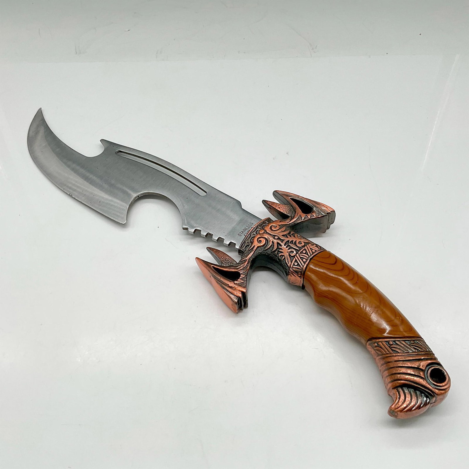 Fantasy Hunting Fighting Knife: This sleek, intricate designed knife is made of stainless steel cut blade with copper colored metal hilt with composite handle. Stainless China impressed mark. This item has its original box: 4"L x 15