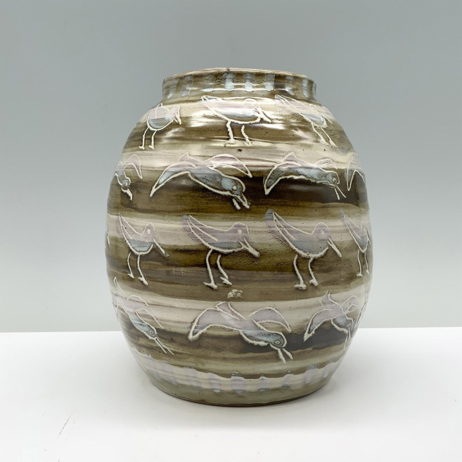 Maryware Ceramic Art Pottery Vase, Seagulls: A charming, glazed vase in white and stone colors, elegantly decorated with images of seagulls in flight and walking along the shore. Maryware backstamp. Dimensions: 7"H x 5" dia. Manufacturer: Marywa