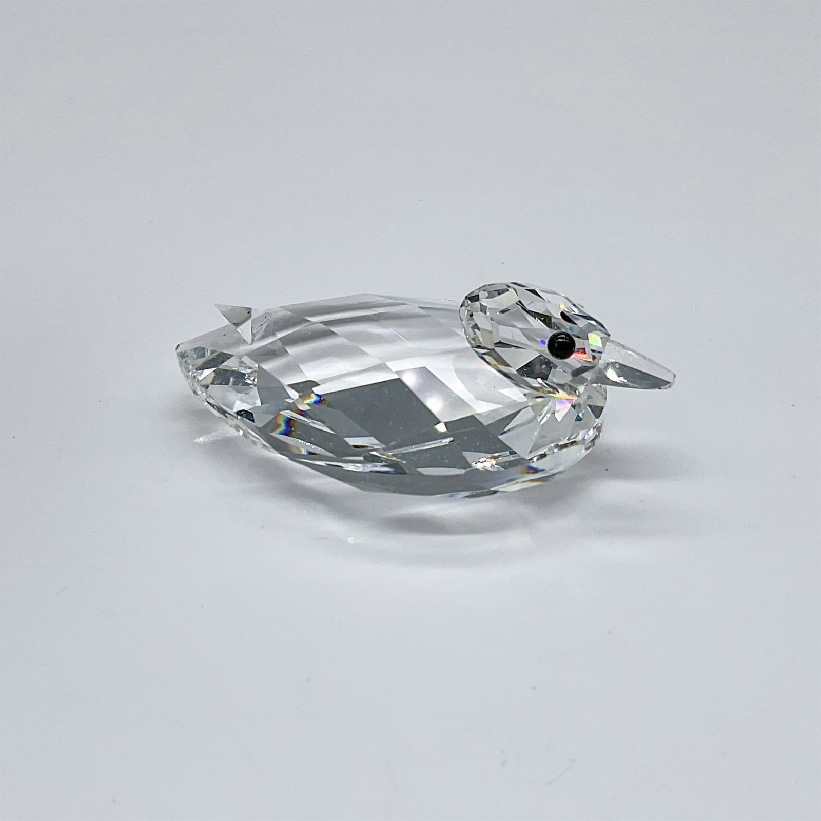 Swarovski Crystal Figurine, Duck Medium: This crystal duck was only available for purchase in the USA and Canada. It is made from clear, facetted crystal and has black eyes. The bill is also made from clear crystal. Swarovski etched backstam