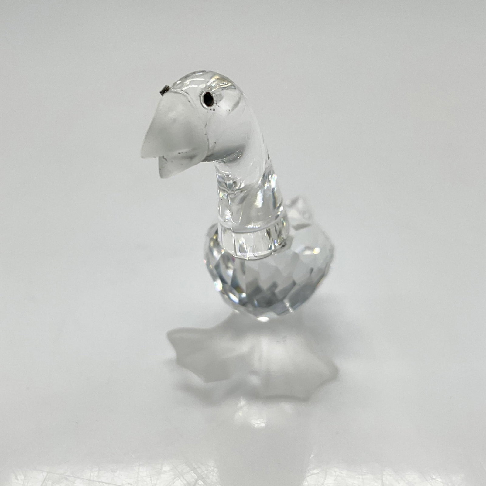 Swarovski Silver Crystal Figurine, Gosling Tom: Part of the Barnyard Friends theme group this clear crystal figure has frosted crystal beak and feet. Swarovski backstamp.7613 000 002. This item has its original box: 2.5"H x 3.25" dia. Artist: Adi S