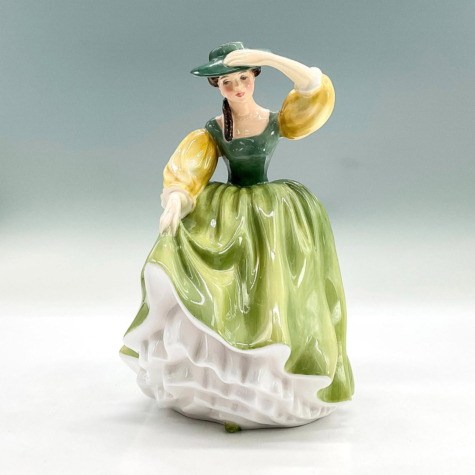 Buttercup - HN2309 - Royal Doulton Figurine: Royal Doulton backstamp. Artist: Peggy Davies Issued: 1964 - 1997 Dimensions: 7"H Manufacturer: Royal Doulton Country of Origin: England