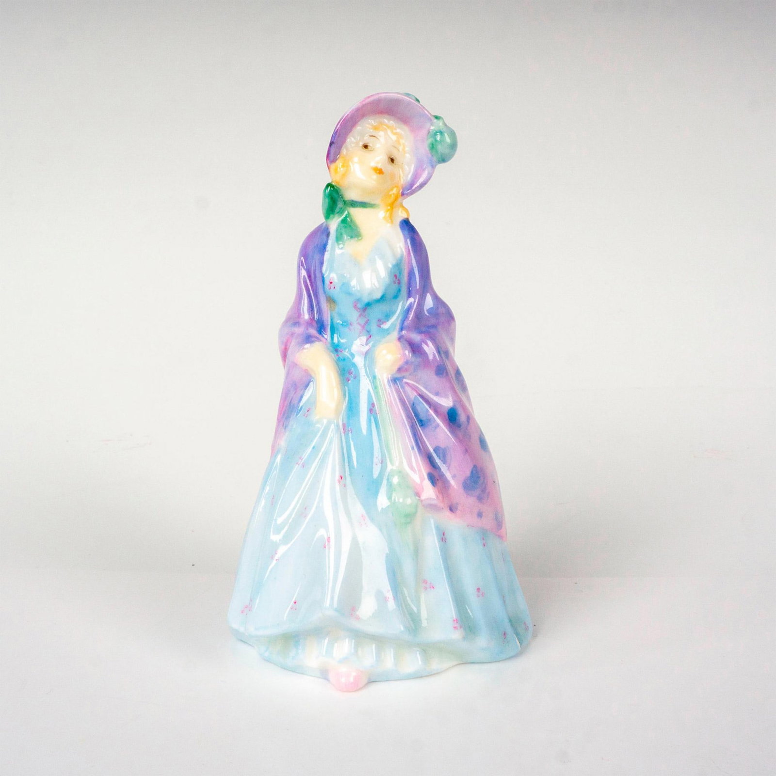 Paisley Shawl - M3 - Royal Doulton Figurine: Artist: Leslie Harradine Issued: 1932 - 1938 Dimensions: 4"H Manufacturer: Royal Doulton Country of Origin: England