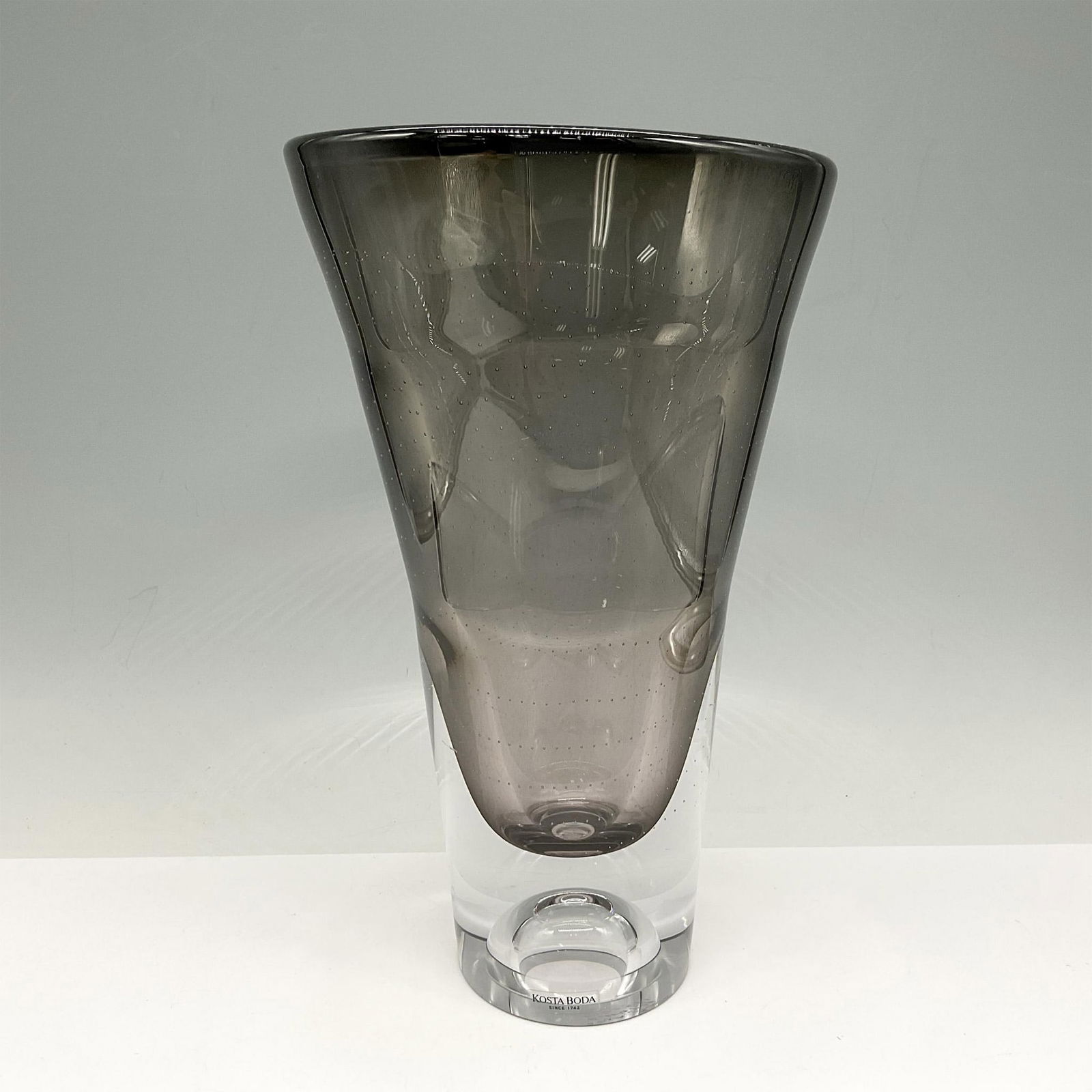 Goran Warff for Kosta Boda Art Glass Vase, Signed: This sommerso glass of clear with smoky gray enhanced by the bullicante design is eye catching. Signed by artist. Kosta Boda etched mark. 7040371. Artist: Goran Warff Issued: 21st century Dimensions: