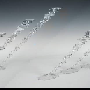 3pc Kosta Boda Ann Wahlstrom Clear Cypress Candlesticks: Three twisted crystal clear glass candle holders that are graduated in size. Artist signature on the bottoms. The largest measures 4.25"dia. x 14.5"H. Artist: Ann Wahlstrom Dimensions: See Description