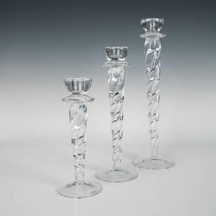 3pc Kosta Boda Ann Wahlstrom Clear Cypress Candlesticks: Three twisted crystal clear glass candle holders that are graduated in size. Artist signature on the bottoms. The largest measures 4.25"dia. x 14.5"H. Artist: Ann Wahlstrom Dimensions: See Description