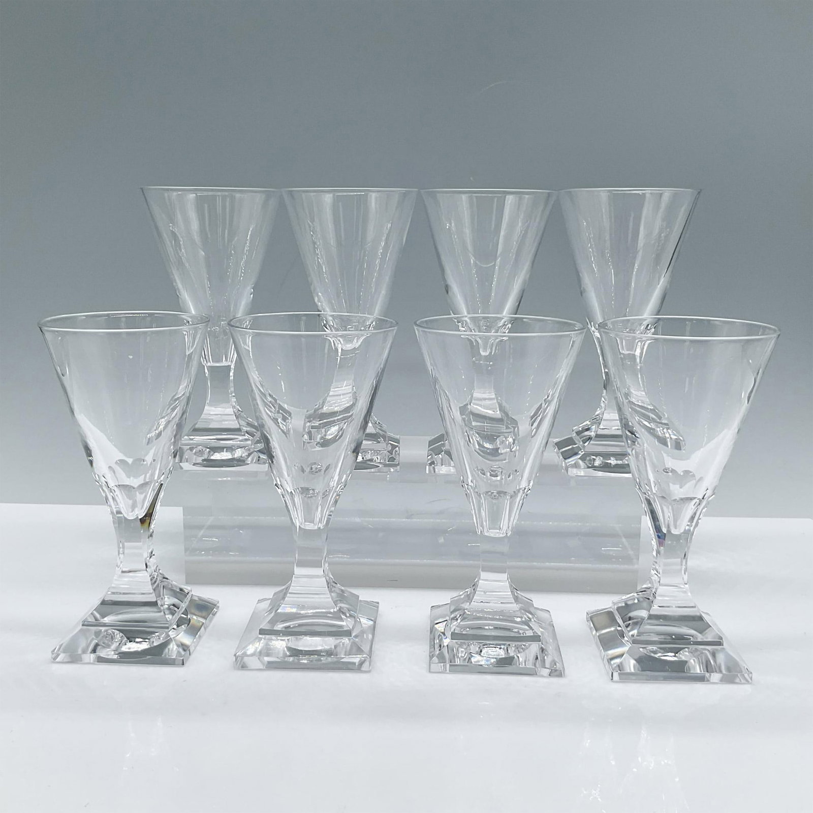 8pc Crystal Stemmed Cordial Glasses, Square Base: Beautiful set of lead clear crystal, they feature a fluid shape and stacked square bases. Issued: 20th century Dimensions: 2''L x 2.5''W x 5''H, Each