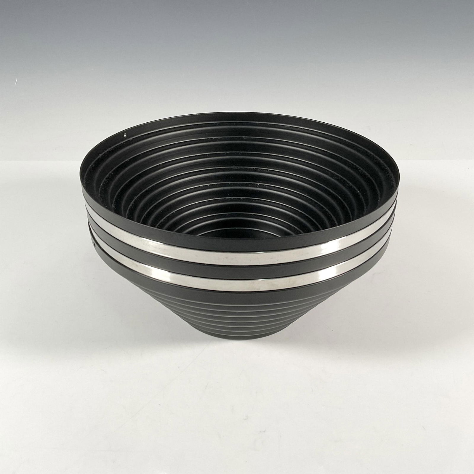 5pc Steel Maya Bowls by Alessi: This set features five fruit or centerpiece bowls, with three crafted from epoxy resin in a matte black finish and the other two in shiny chrome. Designed by a group of Italian graphic designers for A