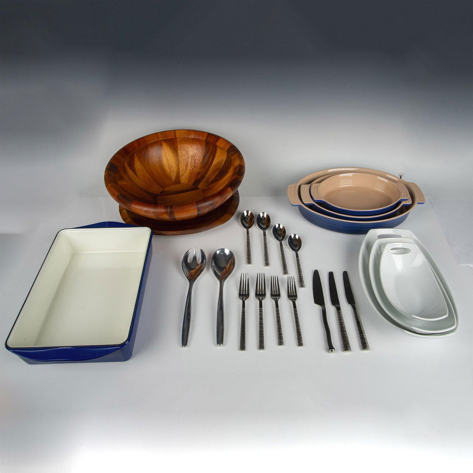11pc Le Creuset & Dansk Bakeware & Serveware: Lot includes mixed stainless-steel flatware, no mark - 3 knives, 2 teaspoons, 2 tablespoons, 2 forks, 2 salad forks; Salad servers, Le Creuset enameled casserole dishes in 11", 13" & 16"; Dansk Cast I