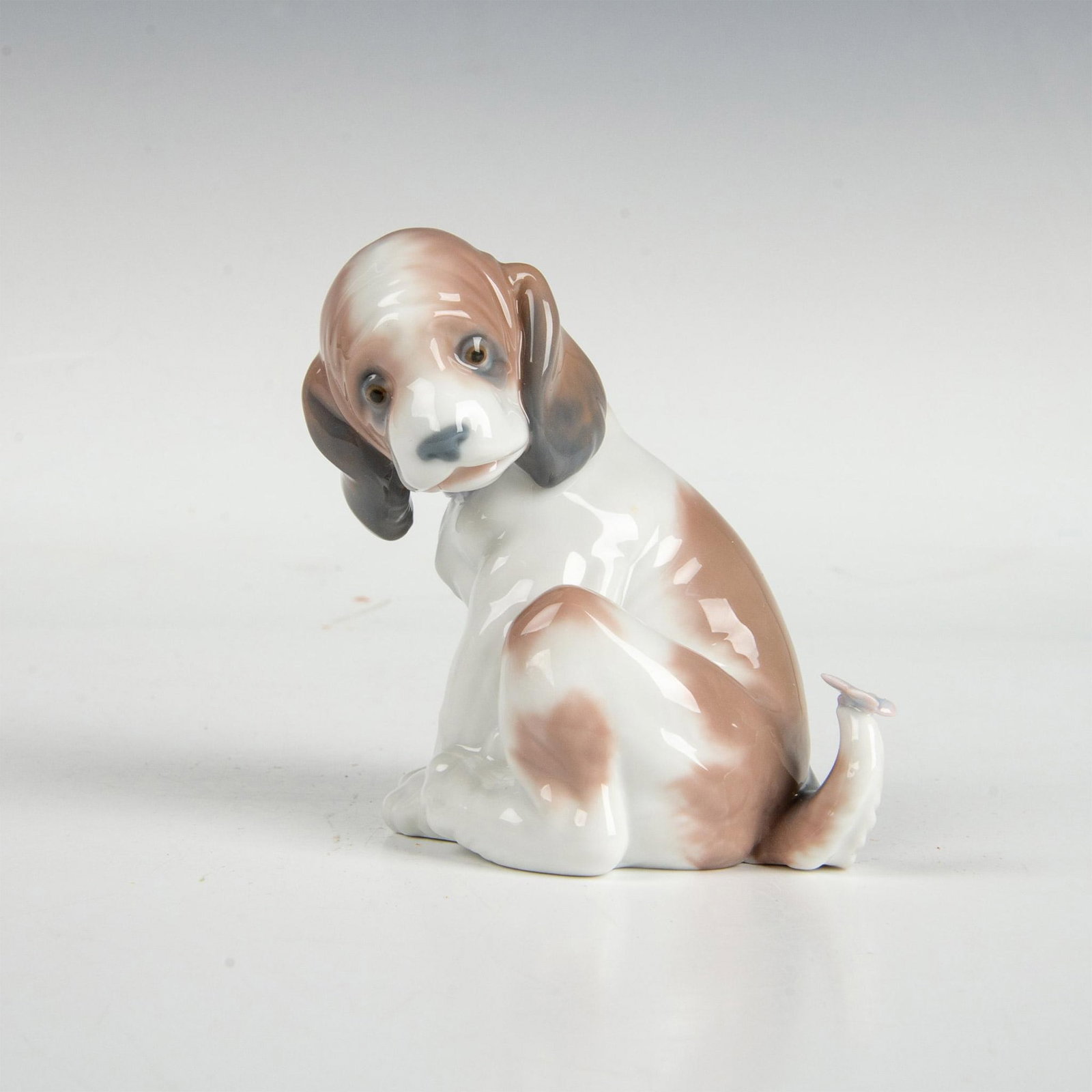 Gentle Surprise 1006210 - Lladro Porcelain Figurine: Glossy finish; Lladro backstamp. This item comes with original box which measures 8"L x 5.25"W x 5"H. Artist: Juan Huerta Issued: 1995 Dimensions: 4.25"H x 4.25"W Manufacturer: Lladro Country of Origi