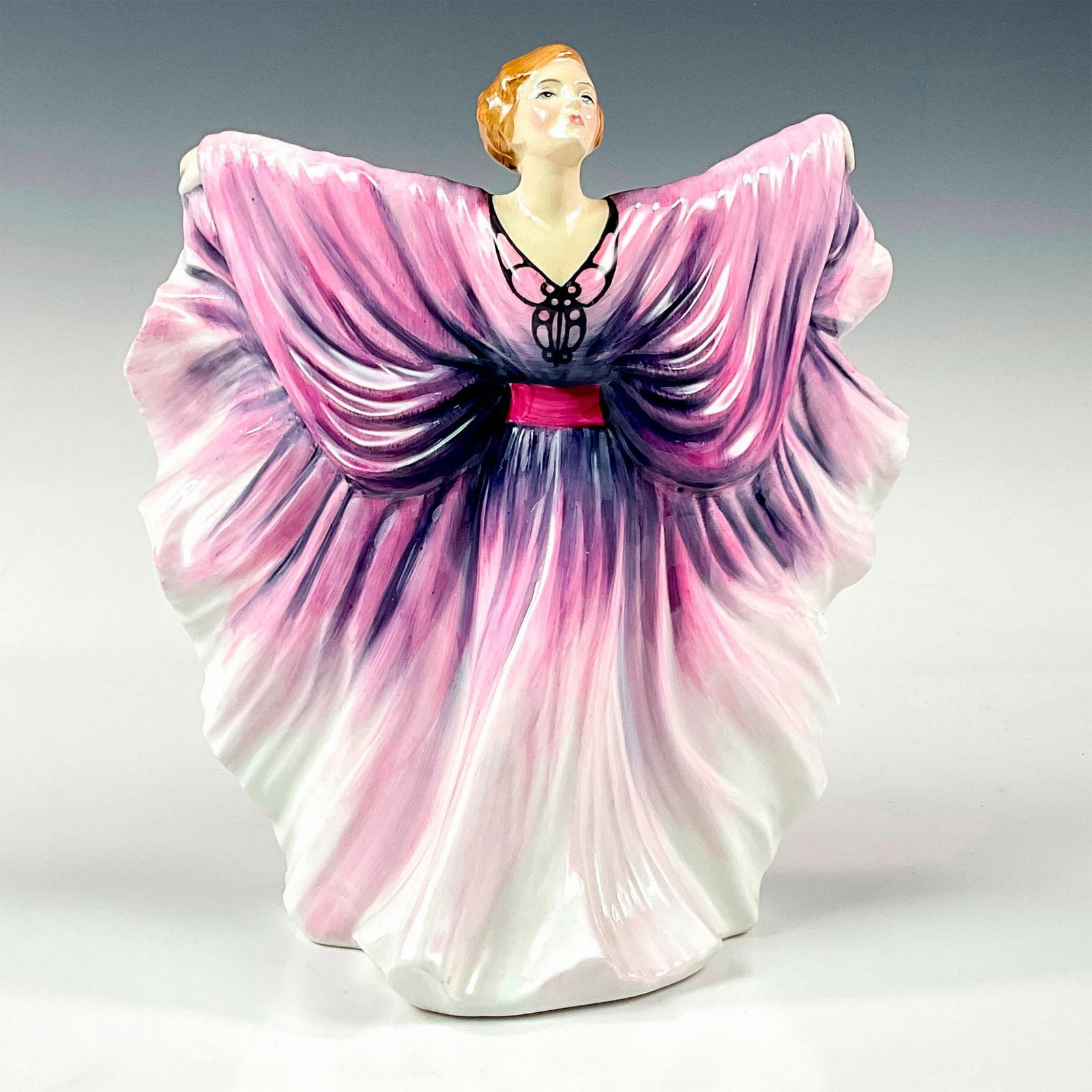 Isadora HN2938 - Royal Doulton Figurine: Woman in beautiful pink, purple and white butterfly dress. Classic Pretty Ladies series. Royal Doulton backstamp. Artist: Peter Gee Issued: 1986 - 1992 Dimensions: 8"H Manufacturer: Royal Doulton Cou