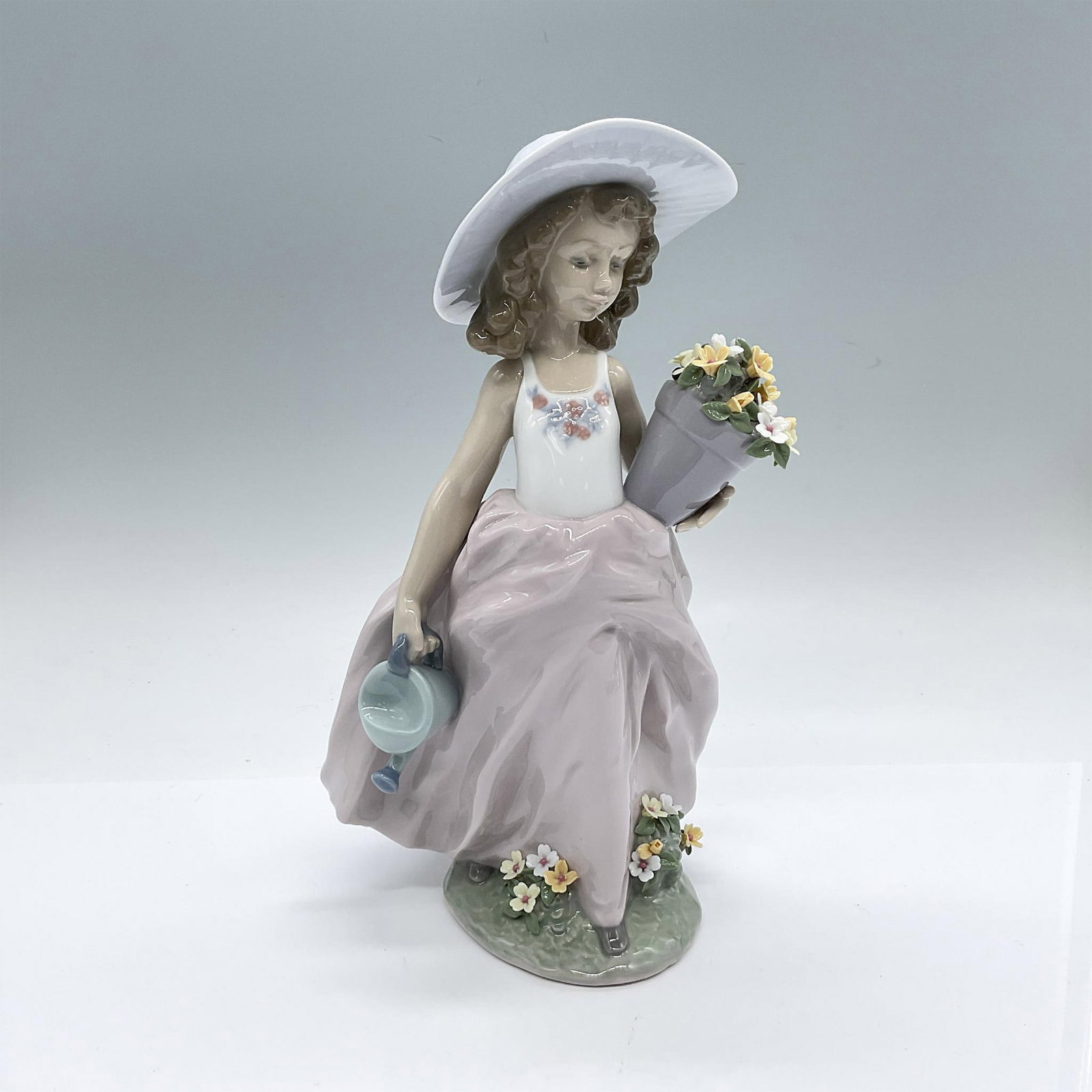 A Wish Come True 1007676 - Lladro Porcelain Figurine: Glossy finish; Lladro backstamp. Includes original box: 12"L x 7.5"W x 6"H. Artist: Antonio Ramos Issued: 1999-2000 Dimensions: 5.5"L x 5.25"W x 9.5"H Manufacturer: Lladro Country of Origin: Spai