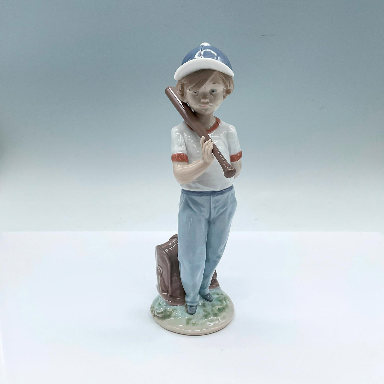 Can I Play ? 1007610 - Lladro Porcelain Figurine: Glossy finish; Lladro backstamp. Includes original box: 10.75"L x 5.5"W x 5"H. Artist: Antonio Ramos Issued: 1990 - 1992 Dimensions: 3.75"L x 3"W x 8.25"H Manufacturer: Lladro Country of Origin: