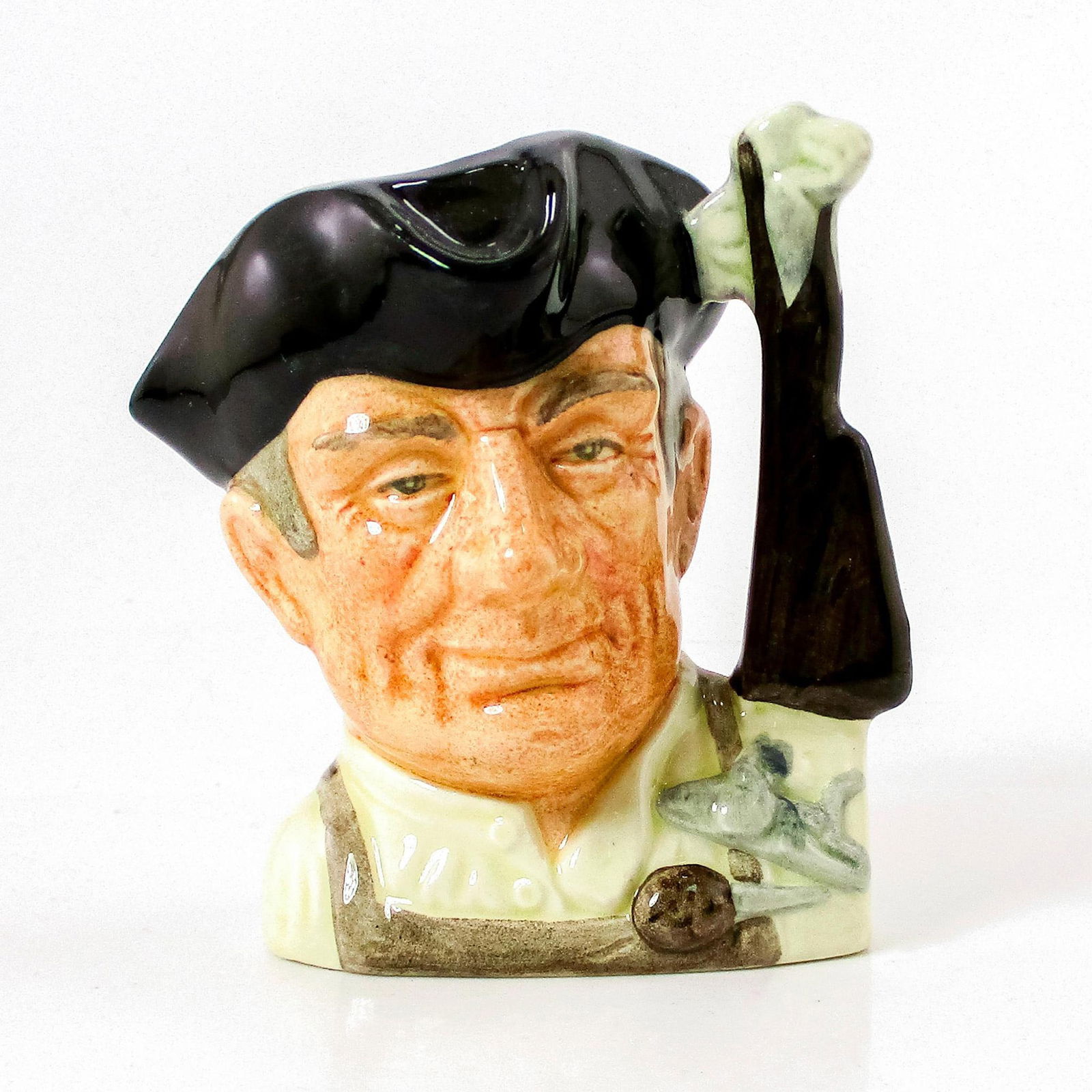 Gunsmith D6580 - Small - Royal Doulton Character Jug: Black hat; cream shirt; light brown apron. Series: Characters From Williamsburg. Royal Doulton backstamp. Artist: David B. Biggs Issued: 1963 - 1983 Dimensions: 3.5"H Manufacturer: Royal Doulton C