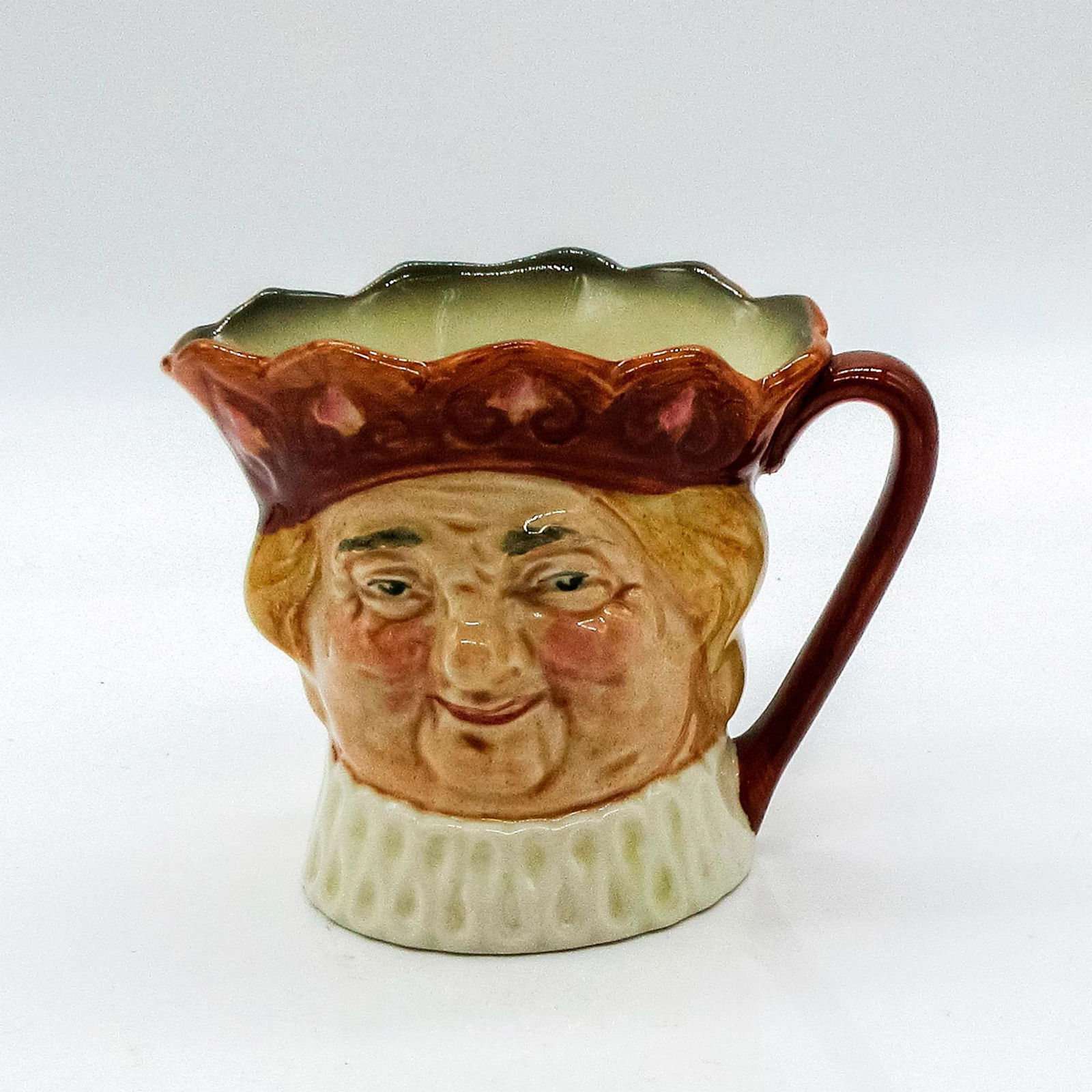 Old King Cole D6036 - Small - Royal Doulton Character Jug: Featuring character design inspired by a nursery rhyme; wears crown and white ruff. Royal Doulton backstamp. #england #oldkingcole #royal #doulton #character #jug Artist: Harry Fenton Issued: 1938-193