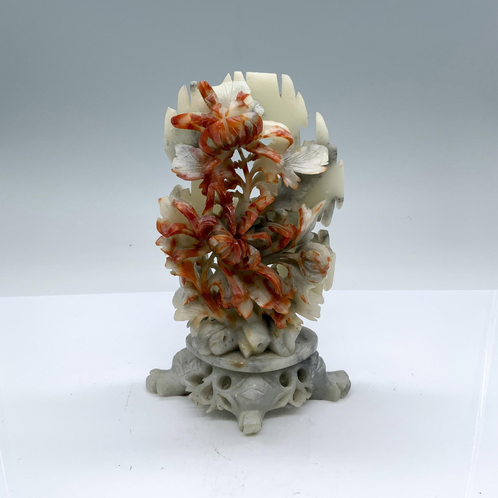 Chinese Carved Soapstone Flowers Sculpture: This beautiful sculpture depicts a bouquet of flowers on a pedestal. Dimensions: 5"L x 3.75"W x 7.5"H