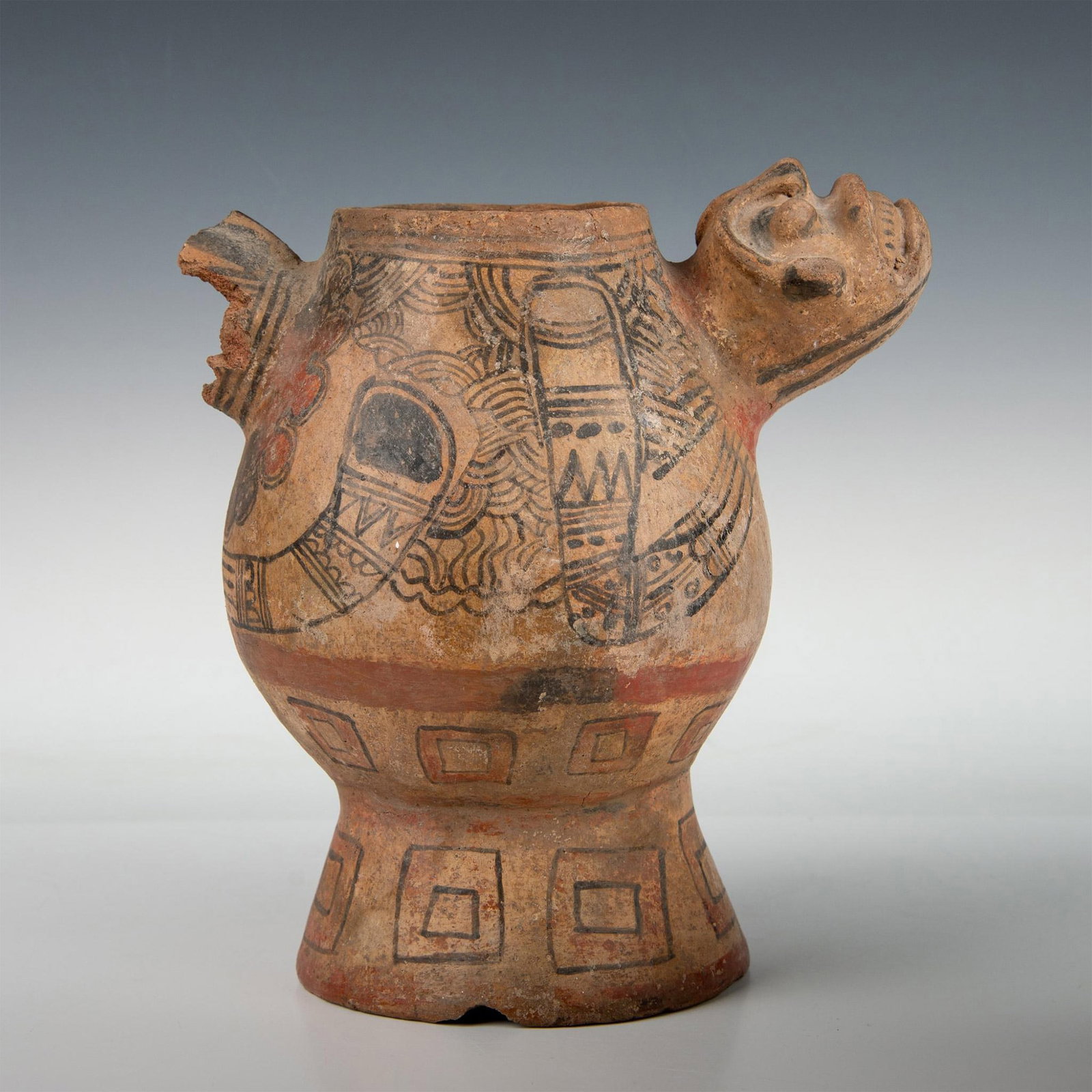 Pre-Columbian Style Hand-Painted Terracotta Jar w/ Effigy: Imposing Pre-Columbian style polychrome hand-painted terracotta pottery vessel with an anthropomorphic deity that serves as one of two handles. The reattached face is painted with black lines above th