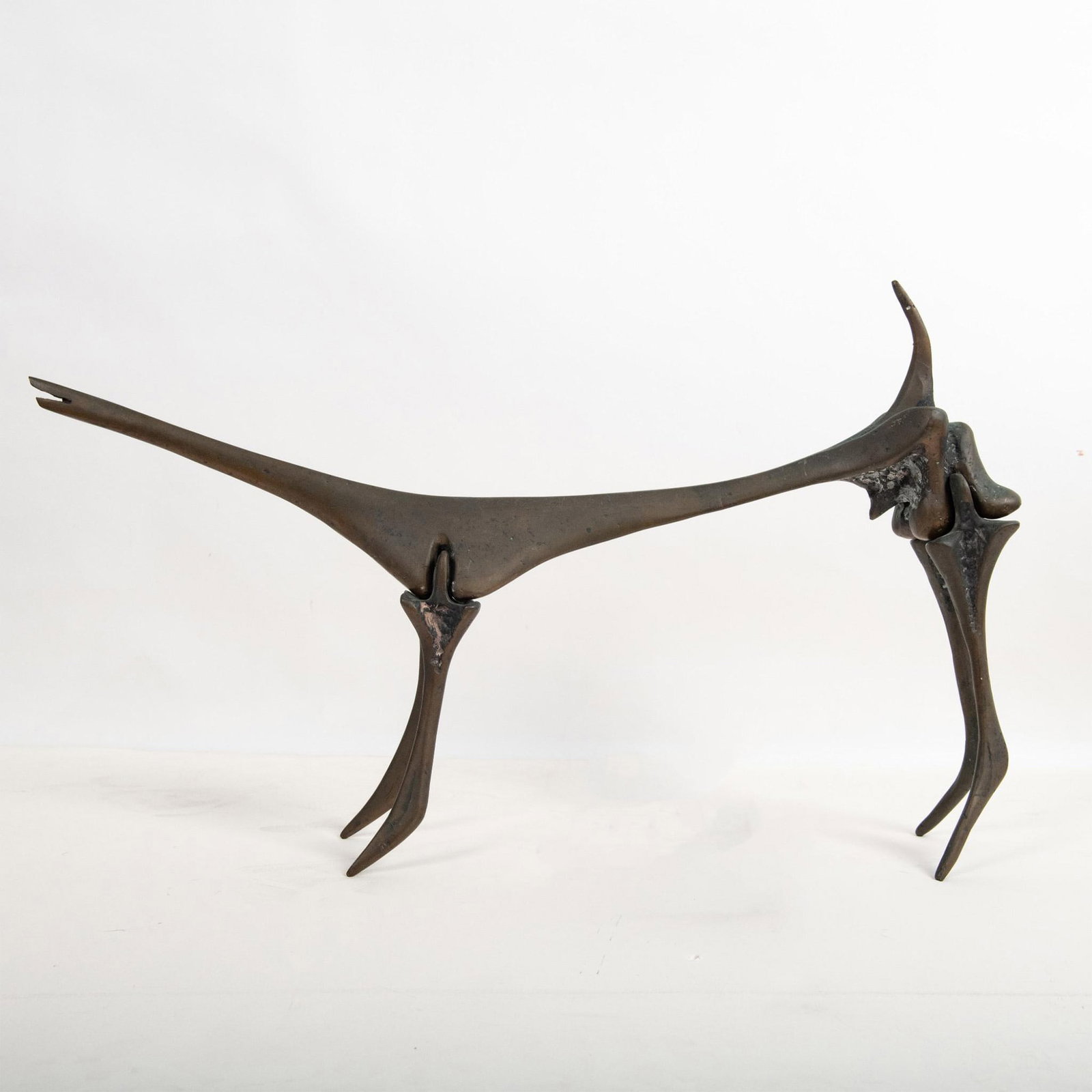 Aharon Bezalel, Original Interchangeable Bronze, Signed: Outstanding original bronze sculpture made in a Brutalist style by Israeli artist Aharon Bezalel of a skeletal shaped dog that includes interchangeable pieces, some patinated and others left in their 