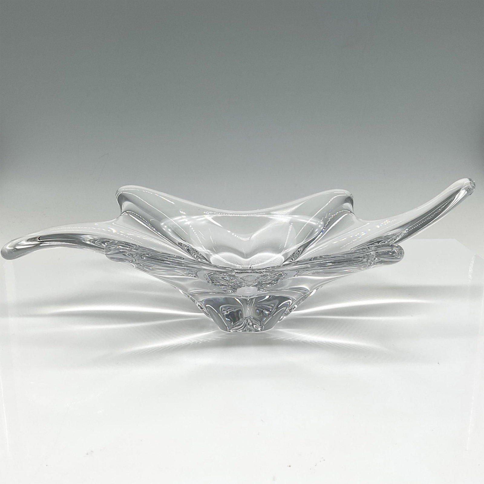 Baccarat Crystal Centerpiece Bowl: This freeform crystal makes a statement with its elegance and unique design. Stunning! Baccarat Crystal acid mark. Issued: 20th century Dimensions: 13"L x 7"W x 4.25"H Manufacturer: Baccarat Country o