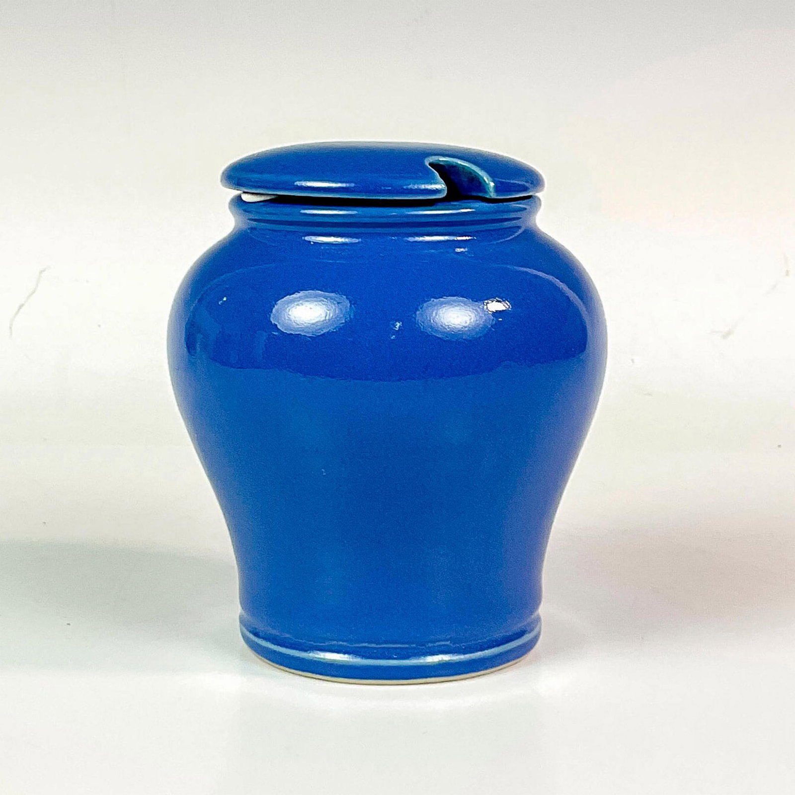 Fortnum and Mason Earthenware Sugar Jar With Lid: Cobalt blue pottery jar with matching lid. Glazed interior and exterior. Fontnum & Mason backstamp. Dimensions: 5"H x 4.5"W Manufacturer: Fontnum & Mason Country of Origin: England