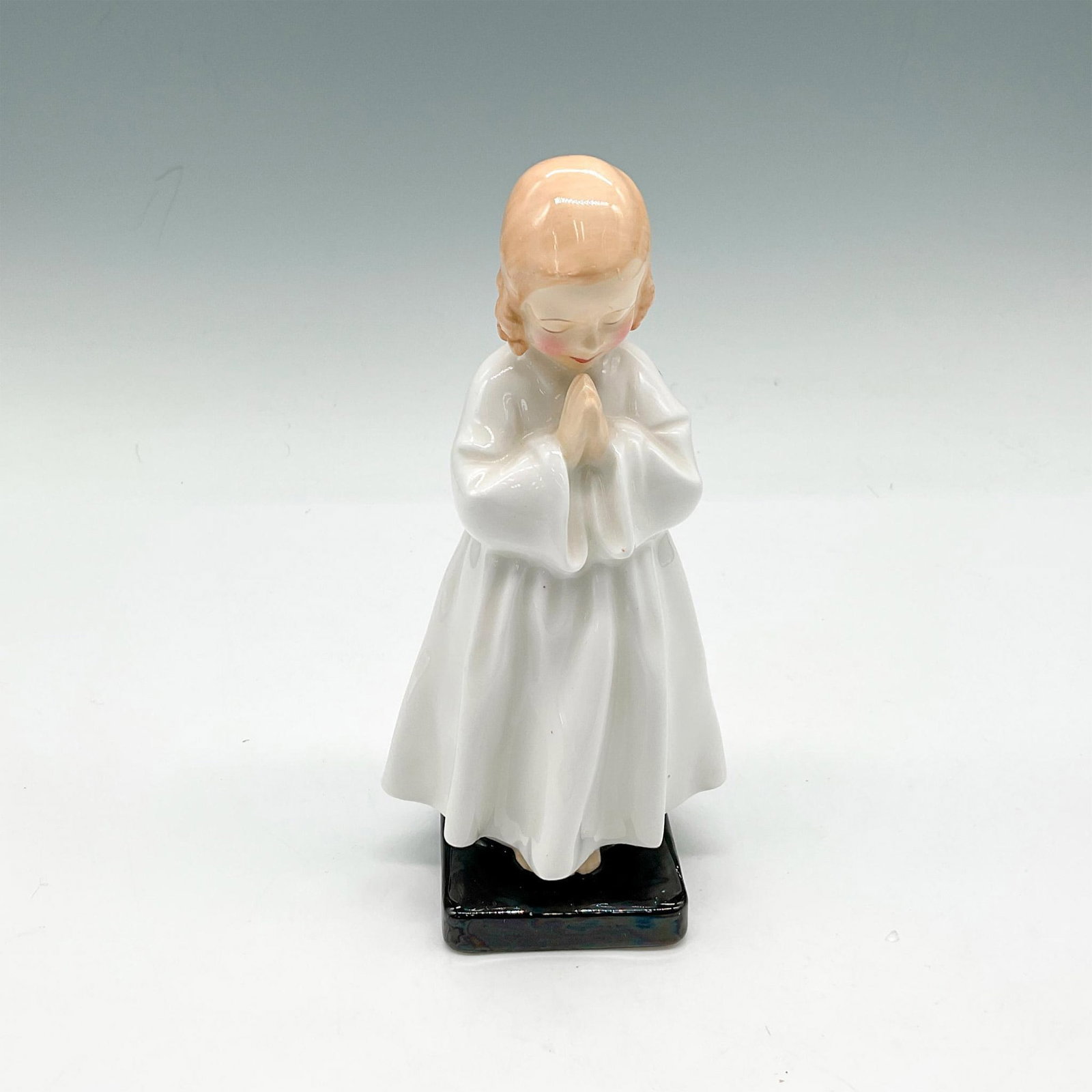 Bedtime - HN1978 - Royal Doulton Figurine: Young girl praying before bed is part of the Harradine Classics series. Royal Doulton backstamp. Artist: Leslie Harradine Issued: 1945 - 1997 Dimensions: 2.5"L x 2.5"W x 5.75"H Manufacturer: Royal Dou