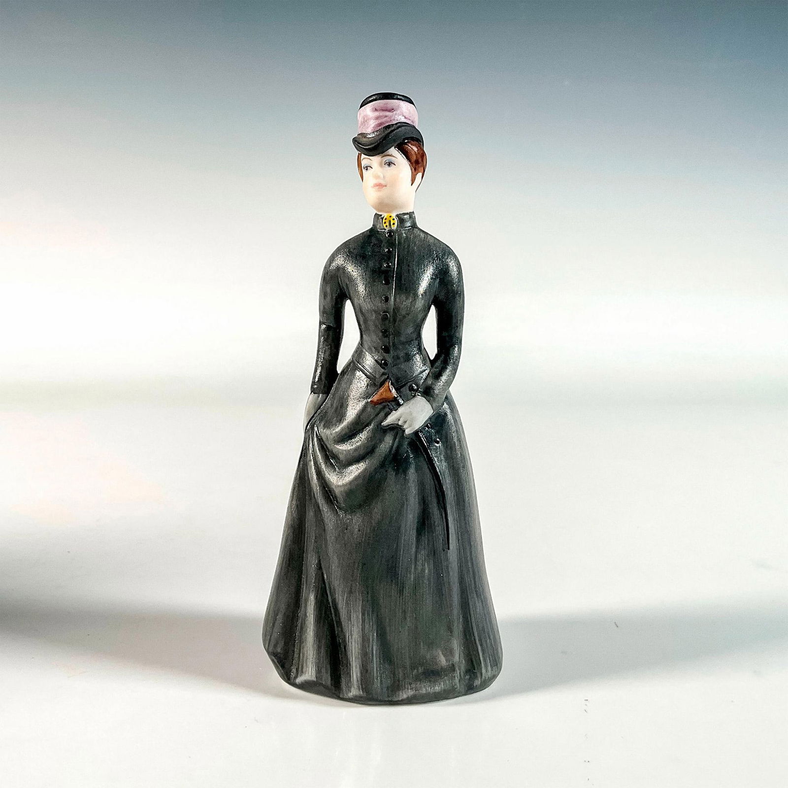 Goebel Porcelain Figurine, Louisa: Hand painted in matte finish. Depicts a lovely Victorian lady out for a stroll. Goebel backstamp. This item has its original box. Box measures: 2.25"l x 2.25"W x 5.25"H. Issued: 20th c. Dimensions: 2"