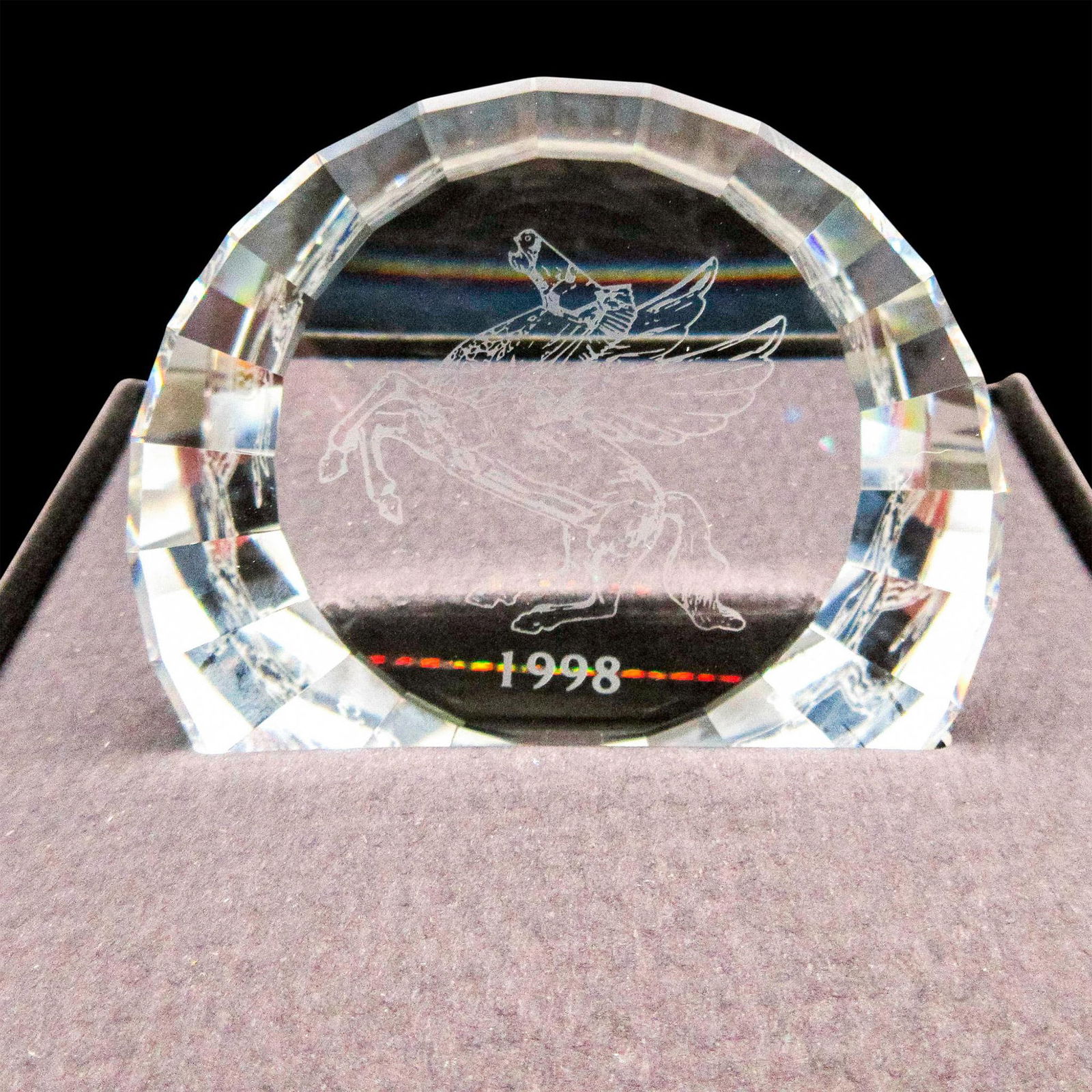 Swarovski, 1998 Pegasus Paperweight: Lead crystal paperweight with Pegasus and the year 1998 etched on the rear surface. Comes with original box. #Swarovski Issued: 1998 Dimensions: 2.25"W Manufacturer: Swarovski Country of Origin: Austr