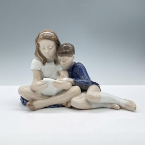 Royal Copenhagen Figurine, Boy and Girl Reading 4670