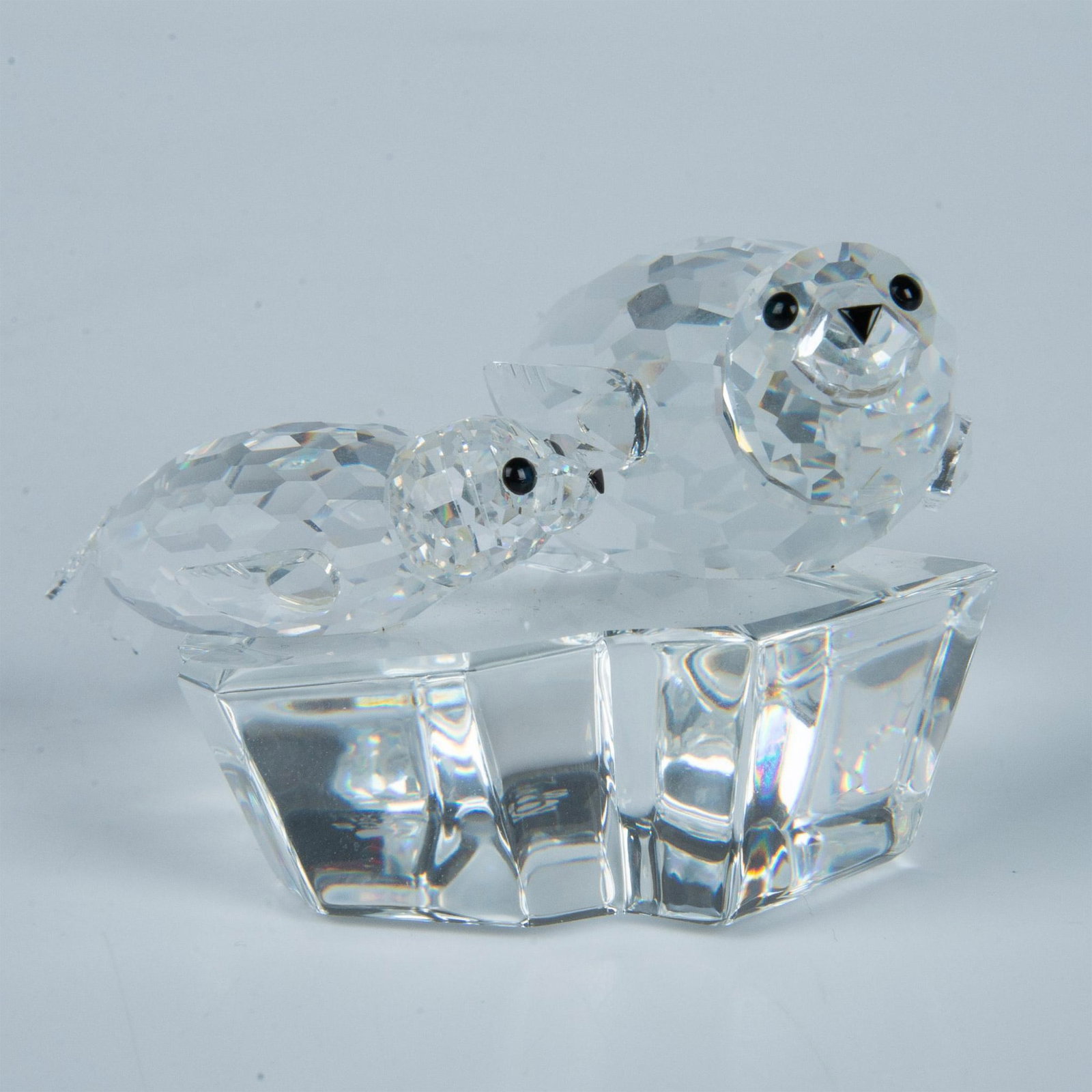 Swarovski Crystal Figurine, SCS Seals Save Me: From the Mother and Baby Swarovski trilogy. Facetted clear crystal with jet black eyes and nose. Swarovski SCS etched backstamp. Artist: Michael Stamey Issued: 1991 Dimensions: 3.5''L x 2.75''W x 2''H