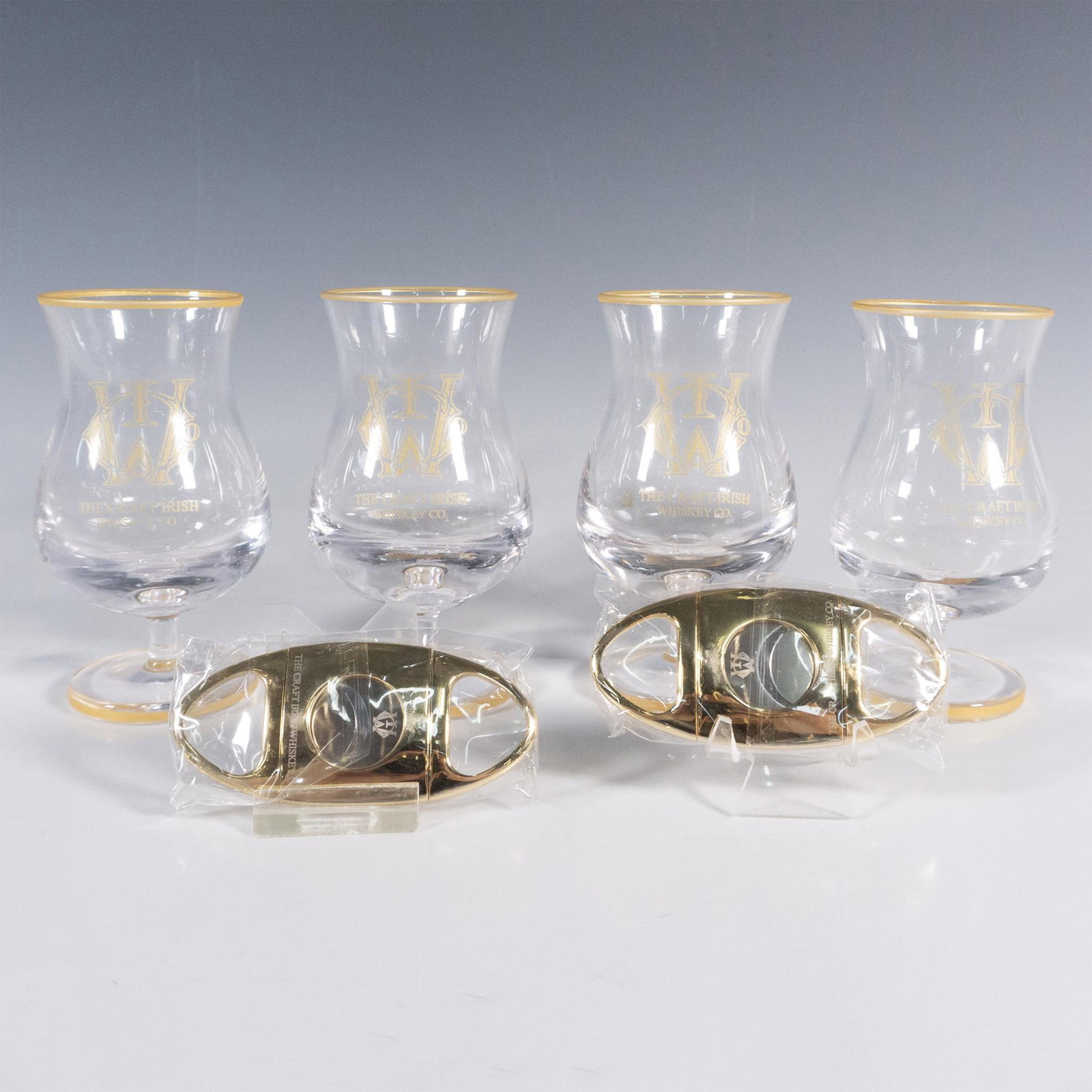 6pc The Craft Irish Whiskey Co. Finn Glass Set: This distinguished collection by The Craft Irish Whiskey Co. proudly showcases their logo and includes four Finn whiskey tasting glasses and two sleek cigar cutters, ensuring an elevated whiskey exper