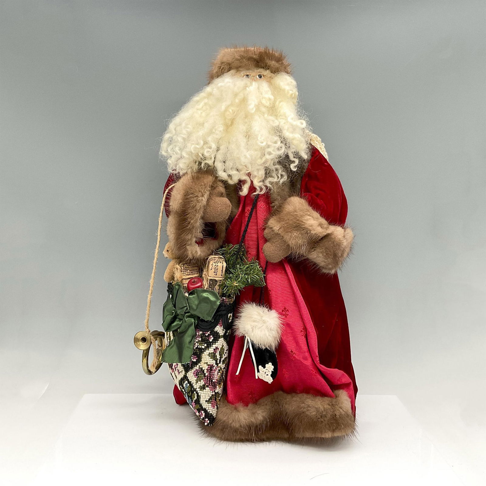 Father Christmas Figurine by Diane Chikey, Signed: Full beard, fur hat, long coat with fur trim carrying bag of gifts and his horn to announce his arrival. Wonderfully detailed, a great addition to your holiday decor. Signed and dated. Diane Chikey 19