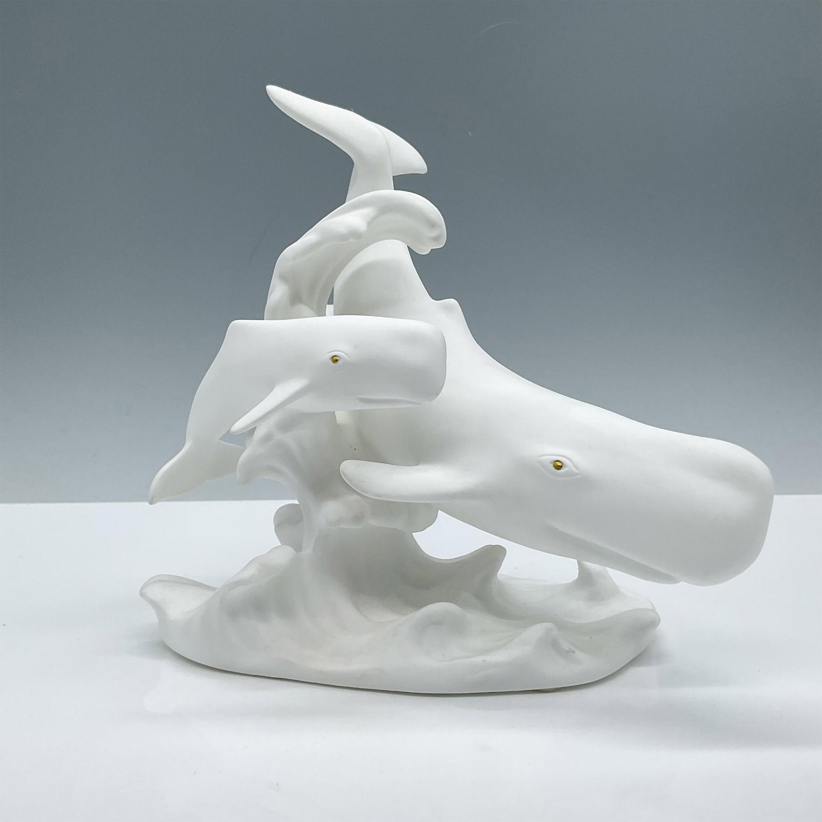 Lenox Fine Bone China Figurine, Journey of the Whales: Depicts a majestic whale scene of a mother and her baby on their journey through the ocean. Lenox backstamp. Issued: 1993 Dimensions: 4.5''L x 6.75''W x 6.5''H Manufacturer: Lenox