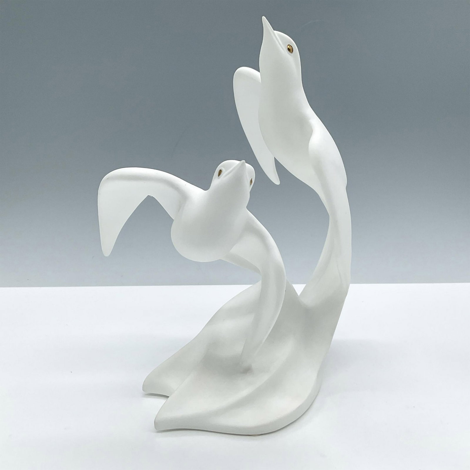 Lenox Fine Bone China Figurine, Wind Dance: Designed in collaboration with the National Audubon Society. Depicts two birds in a dynamic pose with their wings outstretched as if they were dancing in the wind. Lenox backstamp. Issued: 1994 Dimens