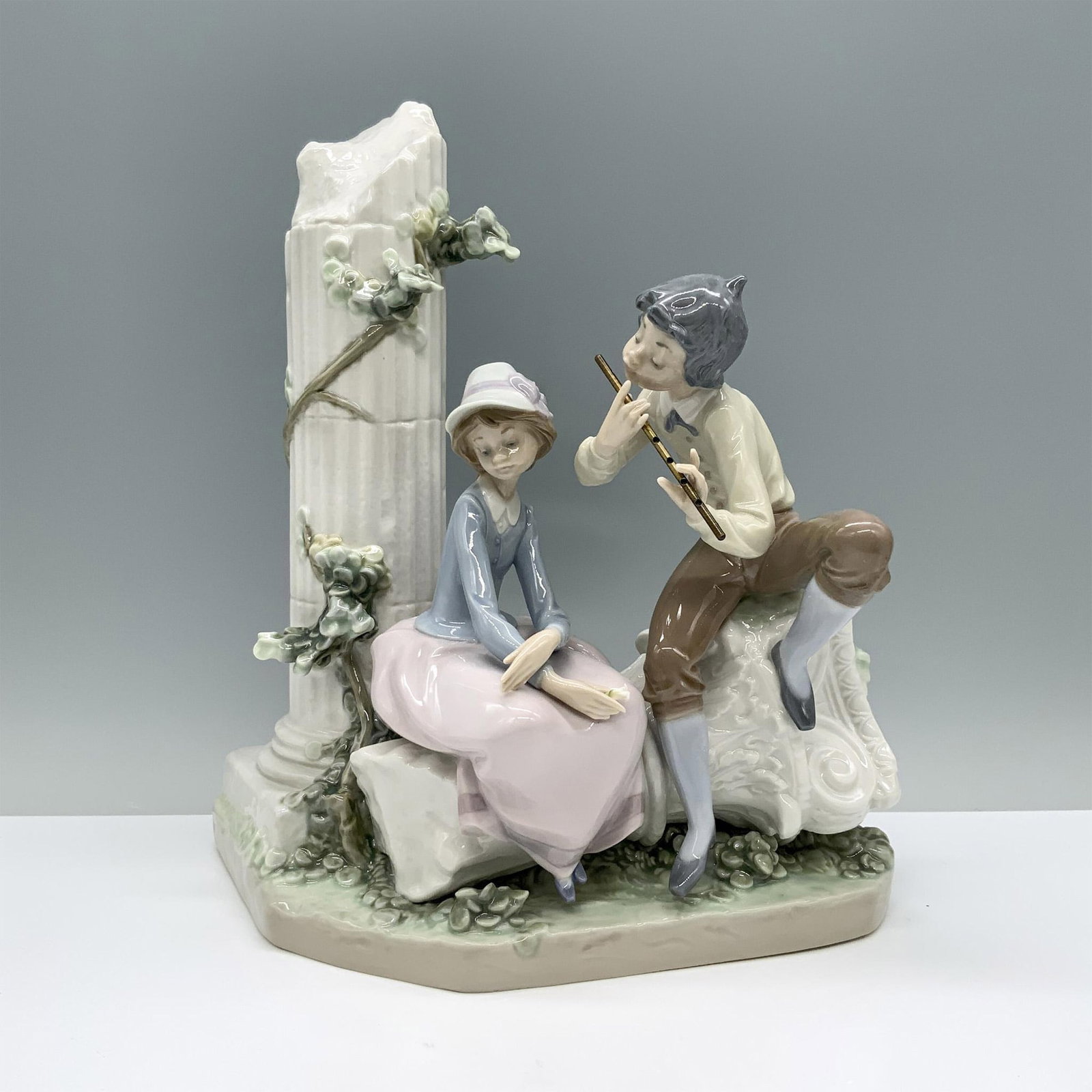 Lover's Serenade 1005382 - Lladro Porcelain Figurine: Glossy finish; Lladro backstamp. Artist: Antonio Ramos Issued: 1986 - 1989 Dimensions: 10.5"H Manufacturer: Lladro Country of Origin: Spain