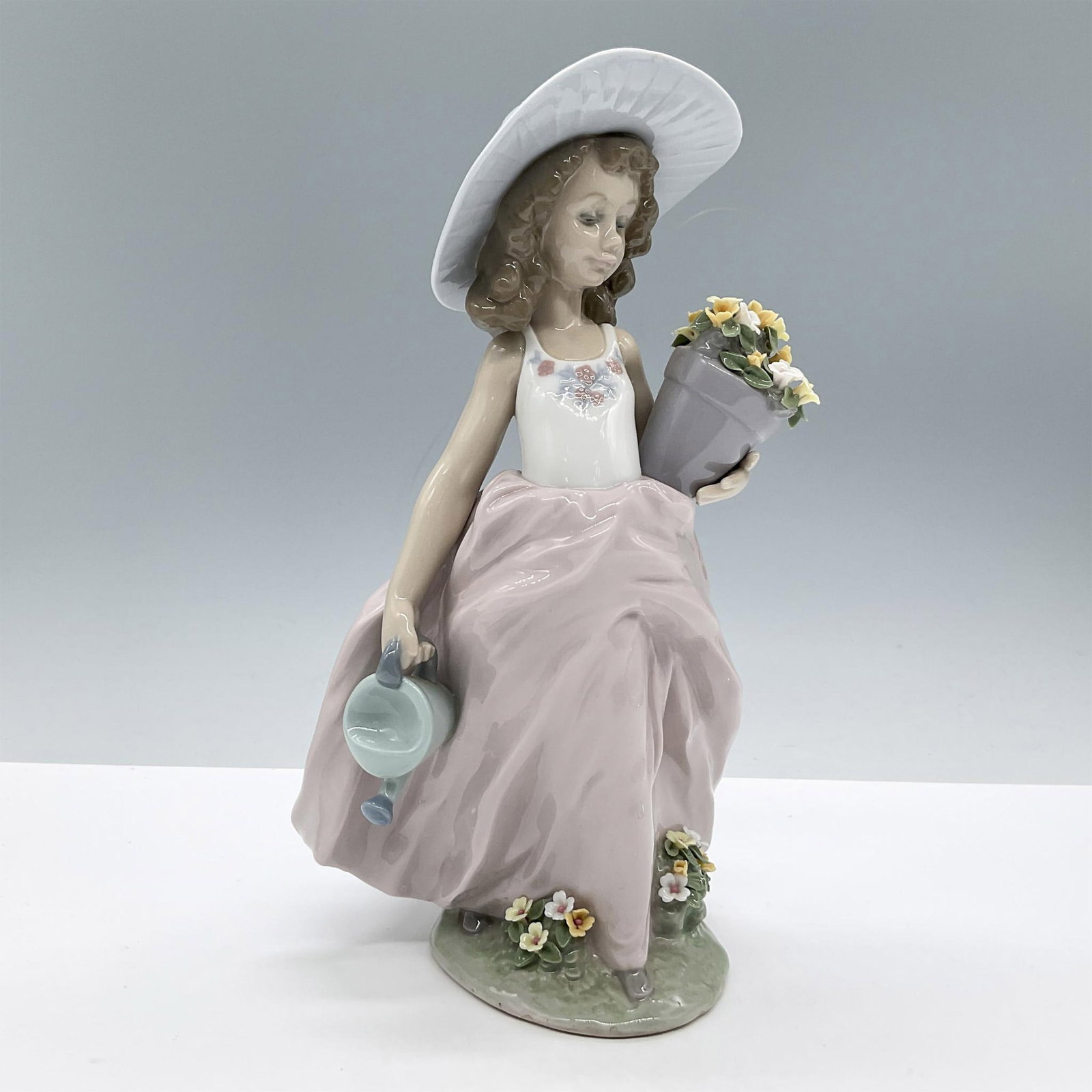 A Wish Come True 1007676 - Lladro Porcelain Figurine: Glossy finish; Lladro backstamp. Includes the certificate and the original box, dimensions: 7.75''L x 11.75''W x 6''H. Artist: Antonio Ramos Issued: 1999 - 2000 Dimensions: 9.5"H x 5.5"W Manufacturer: