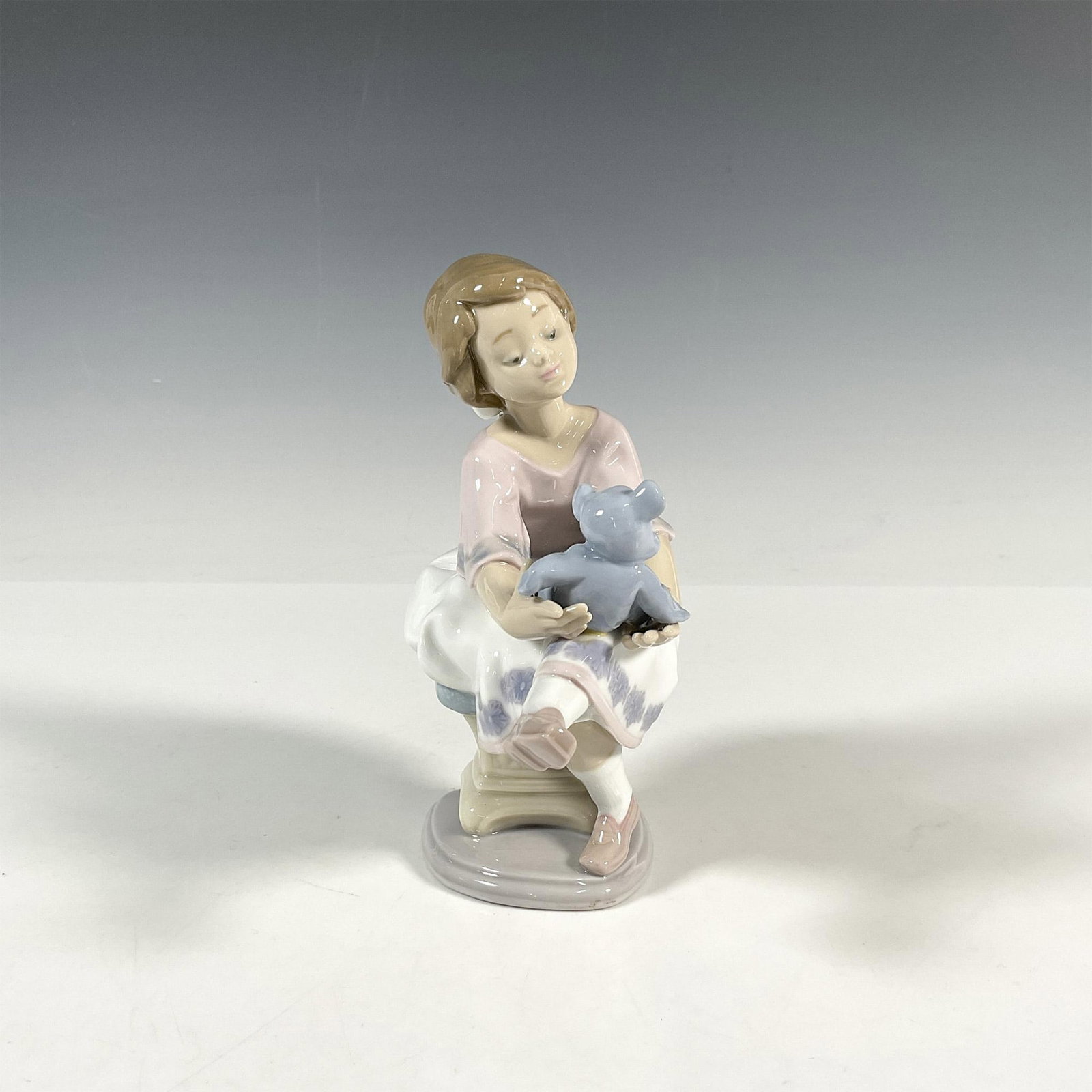 Best Friend 1007620 - Lladro Porcelain Figurine: Glossy finish; Lladro backstamp. Includes original box 10"L x 9"W x 6.25"H. Artist: Francisco Polope Issued: 1993 - 1993 Dimensions: 6.25"H x 5"W Manufacturer: Lladro Country of Origin: Spain