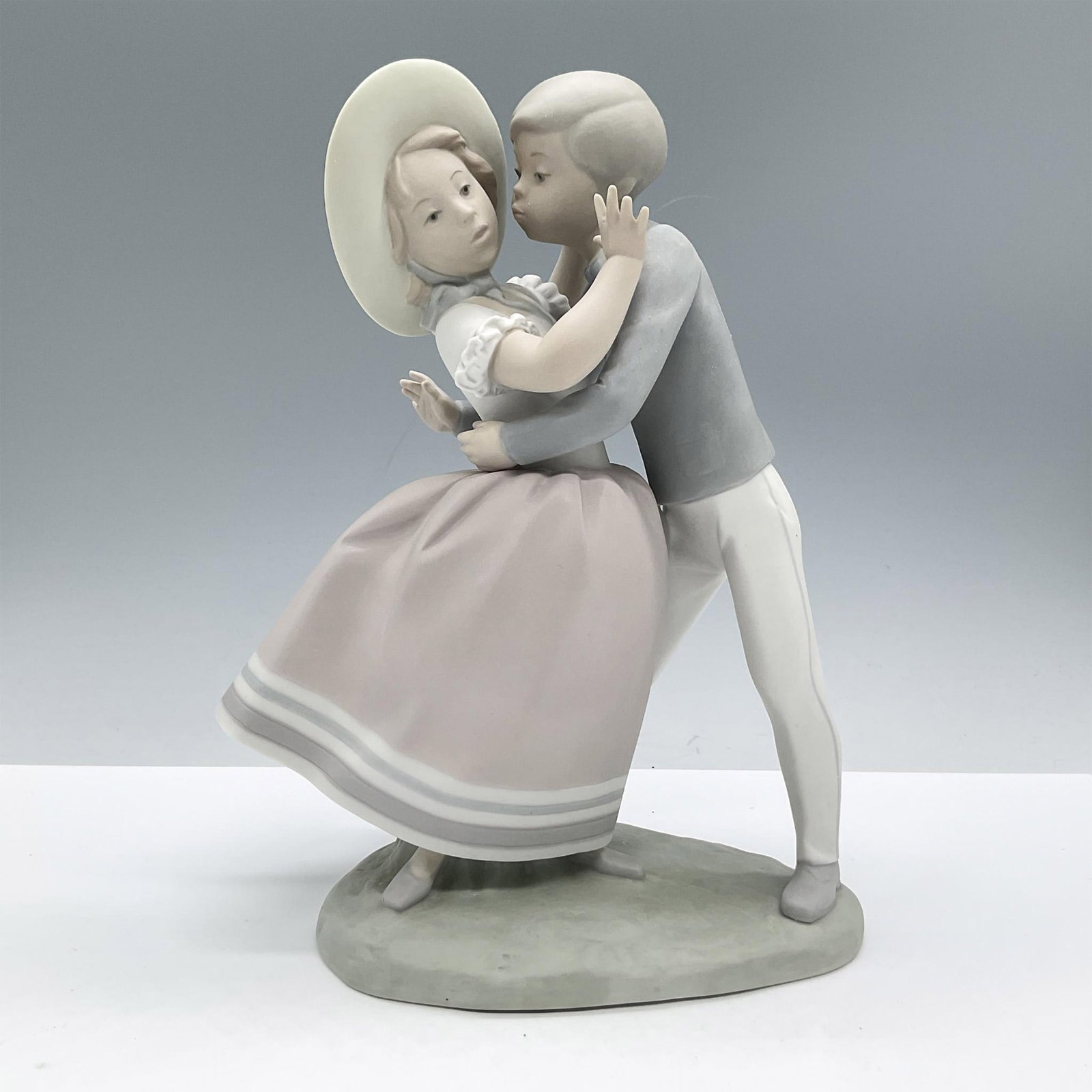 Waltz Time 1014856 - Lladro Porcelain Figurine: Matte finish; Lladro backstamp. Artist: Alfredo Ruiz Issued: 1974 - 1985 Dimensions: 9.5"H Manufacturer: Lladro Country of Origin: Spain
