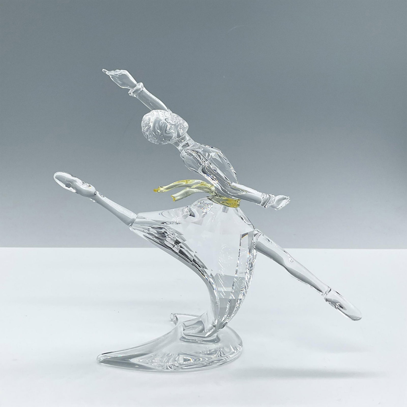 Swarovski Crystal Figurine, Magic of Dance Anna 2004: Gorgeous piece, crafted from clear and yellow crystal, is designed to represent the renowned ballerina Anna Pavlova. Includes the certificate and the original box, dimensions: 9.25''L x 9.5''W x 4''H.