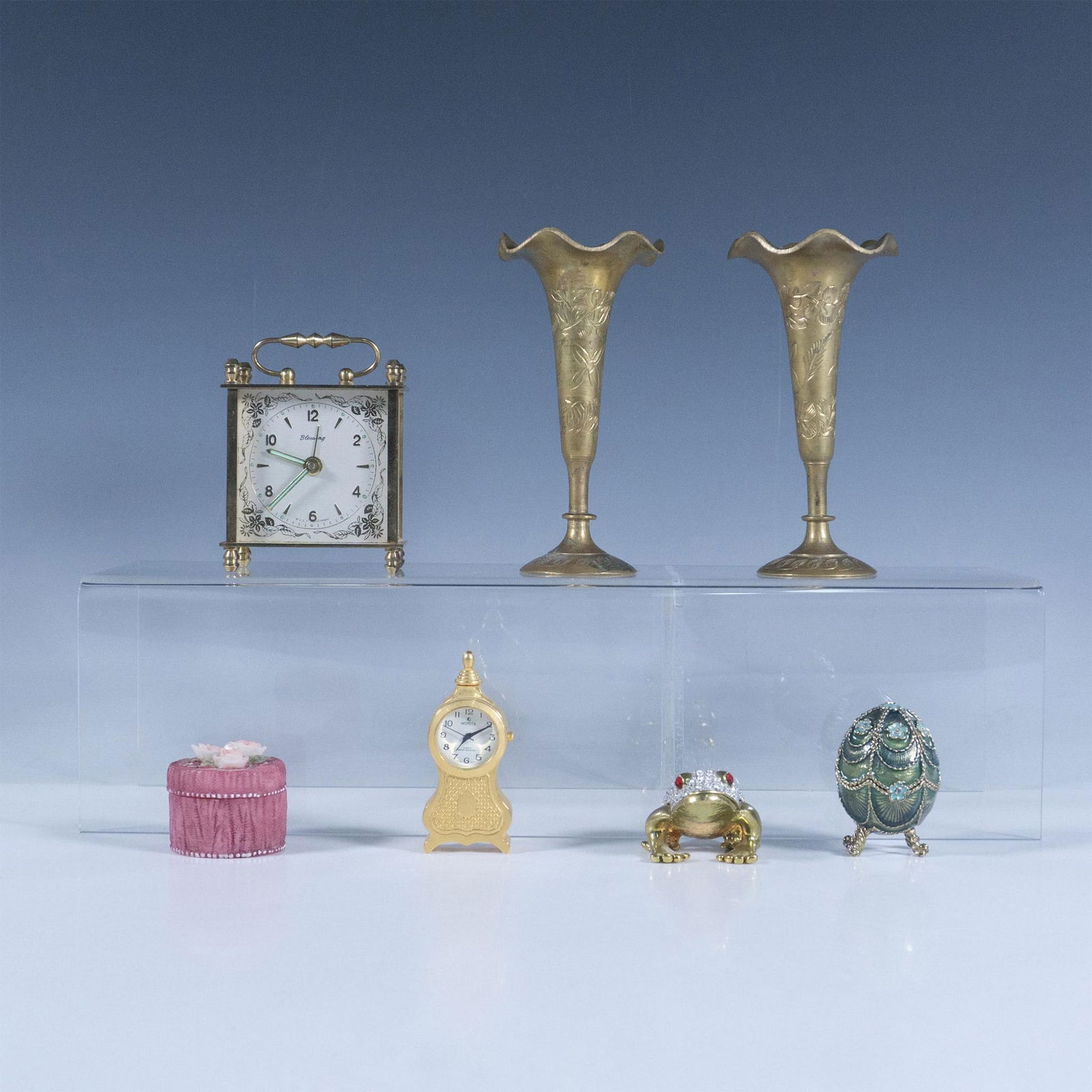 7pc Assorted Vintage Decorative Objects: This group of assorted treasures from around the world includes: Inlaid crystal enamel frog treasure box; Monet Green footed egg treasure box; A hand painted Dezine treasure box; Two antique brass etc