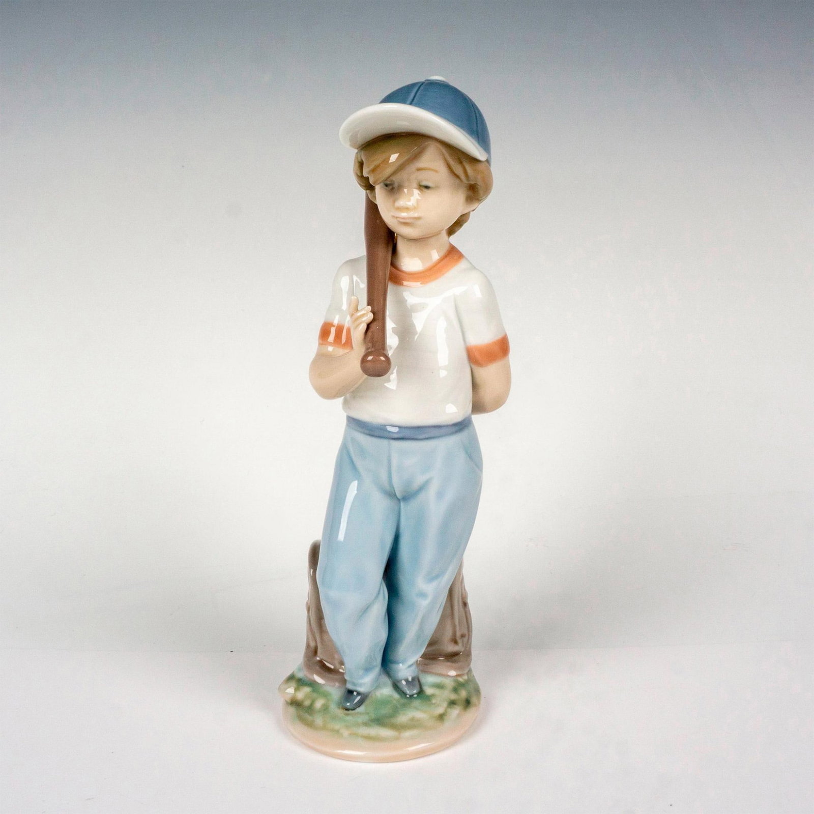 Can I Play? 1007610 - Lladro Porcelain Figurine: Glossy finish; Lladro backstamp. Includes original box. Box measures: 5.75"L x 11.25"W x 5.25"H. Artist: Antonio Ramos Issued: 1990 - 1992 Dimensions: 8.25"H x 3.5"W Manufacturer: Lladro Country of O