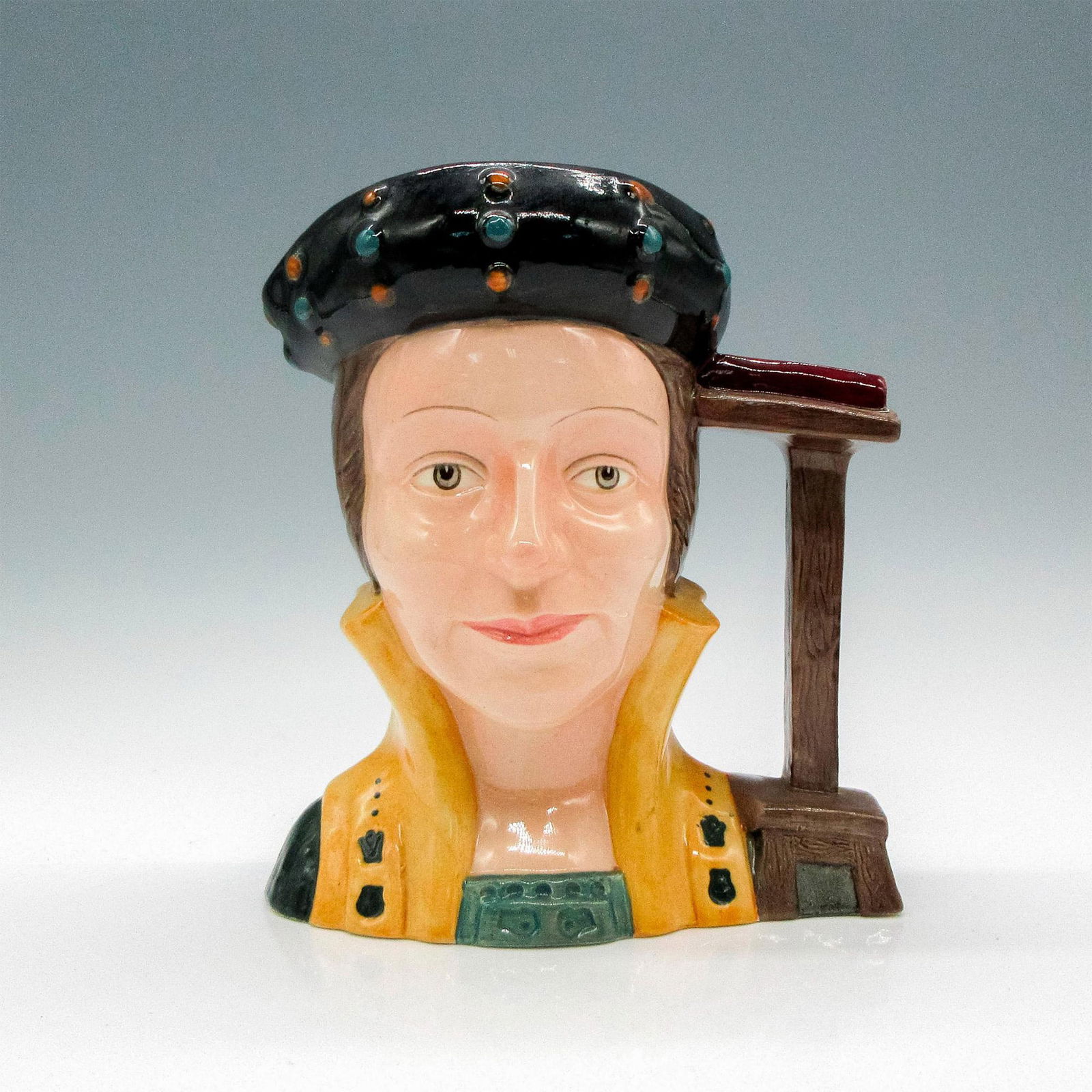 Catherine Parr D6664 - Large - Royal Doulton Character Jug: Style One. Black, brown, and gold coloration. Catherine Parr (1512 - 1548) became Henry VIII's last wife on July 12, 1543, after being twice widowed. She came to wield considerable power in the royal