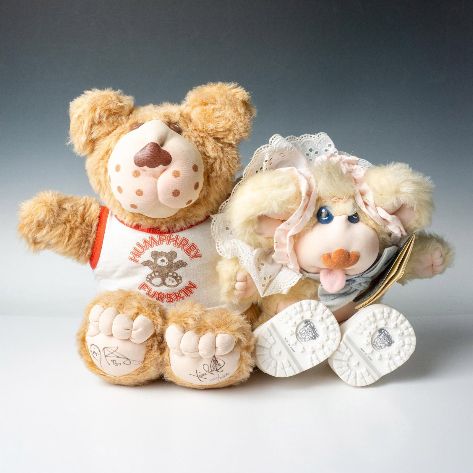 2pc Furskins Stuffed Bears, Humphrey and Thistle: This adorable duo includes: Humphrey, dressed in a white and red shit, limited edition 2111 of 2500. Signed by Xavier Roberts. Thistle, a baby Furskin with white silicon boots, made in Korea. Includes