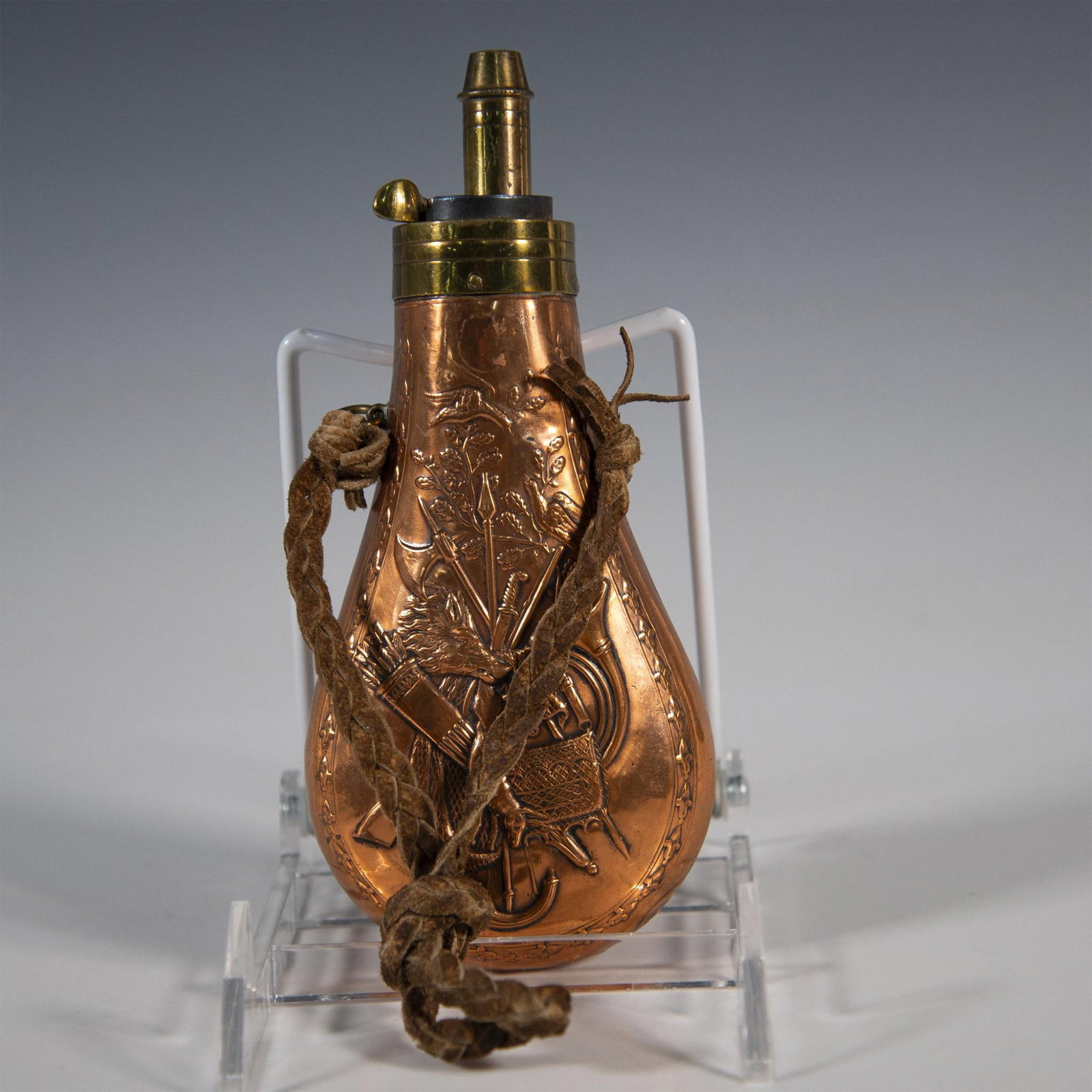 Original French Hunting Powder Copper Flask 19th Century: This outstanding French gun powder flask (poire a poudre de chasse) is made in copper incised on both sides with hunting trophies and bladed weapons. They include hares, wild boars, pheasants, hunting