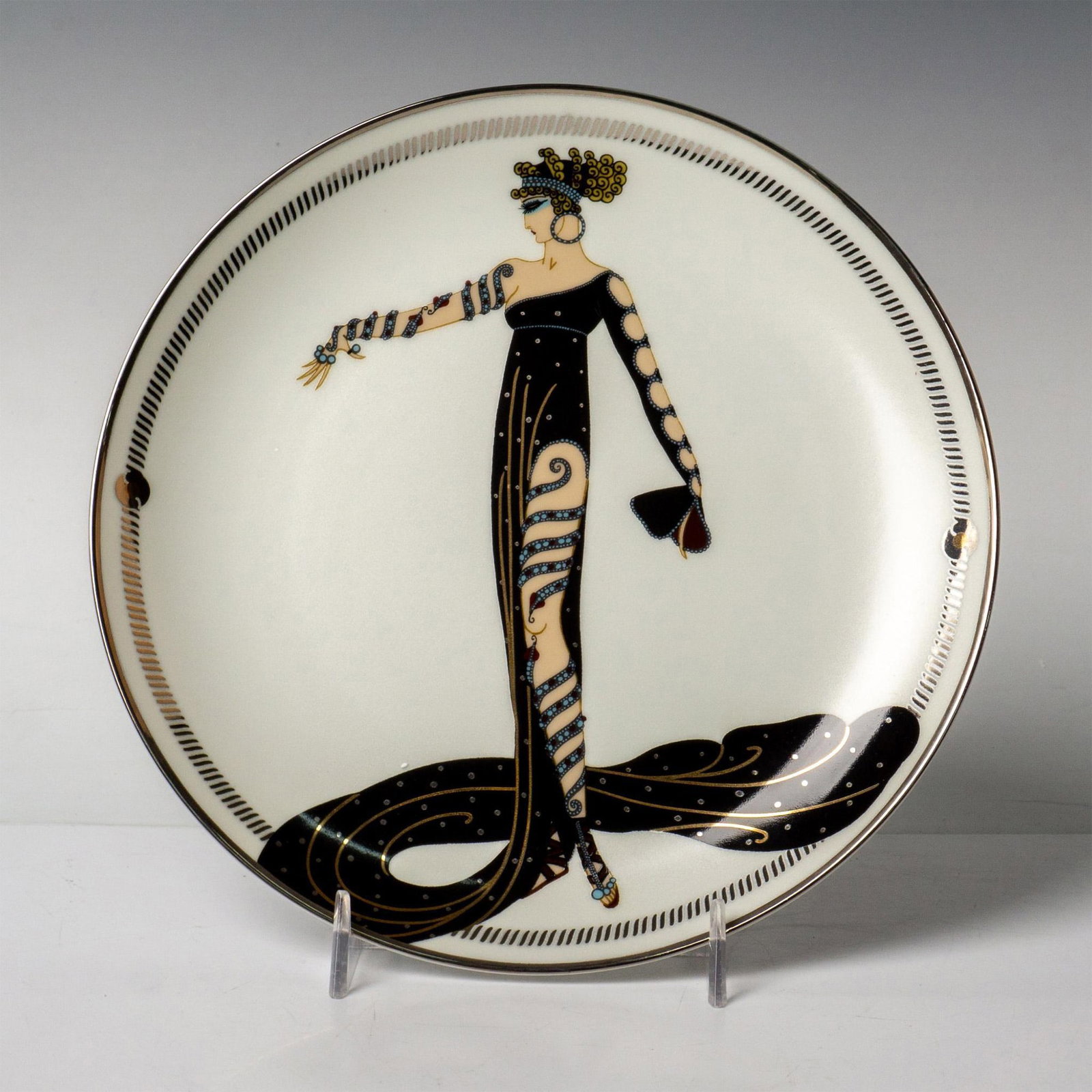 Franklin Mint House of Erte, Collector Plate La Merveilleuse: Franklin Mint collector decorative porcelain plate bordered and hand-numbered with platinum for the House of Erte that depicts a glamorous female as La Merveilleuse by Art Deco artist Erte. On verso: