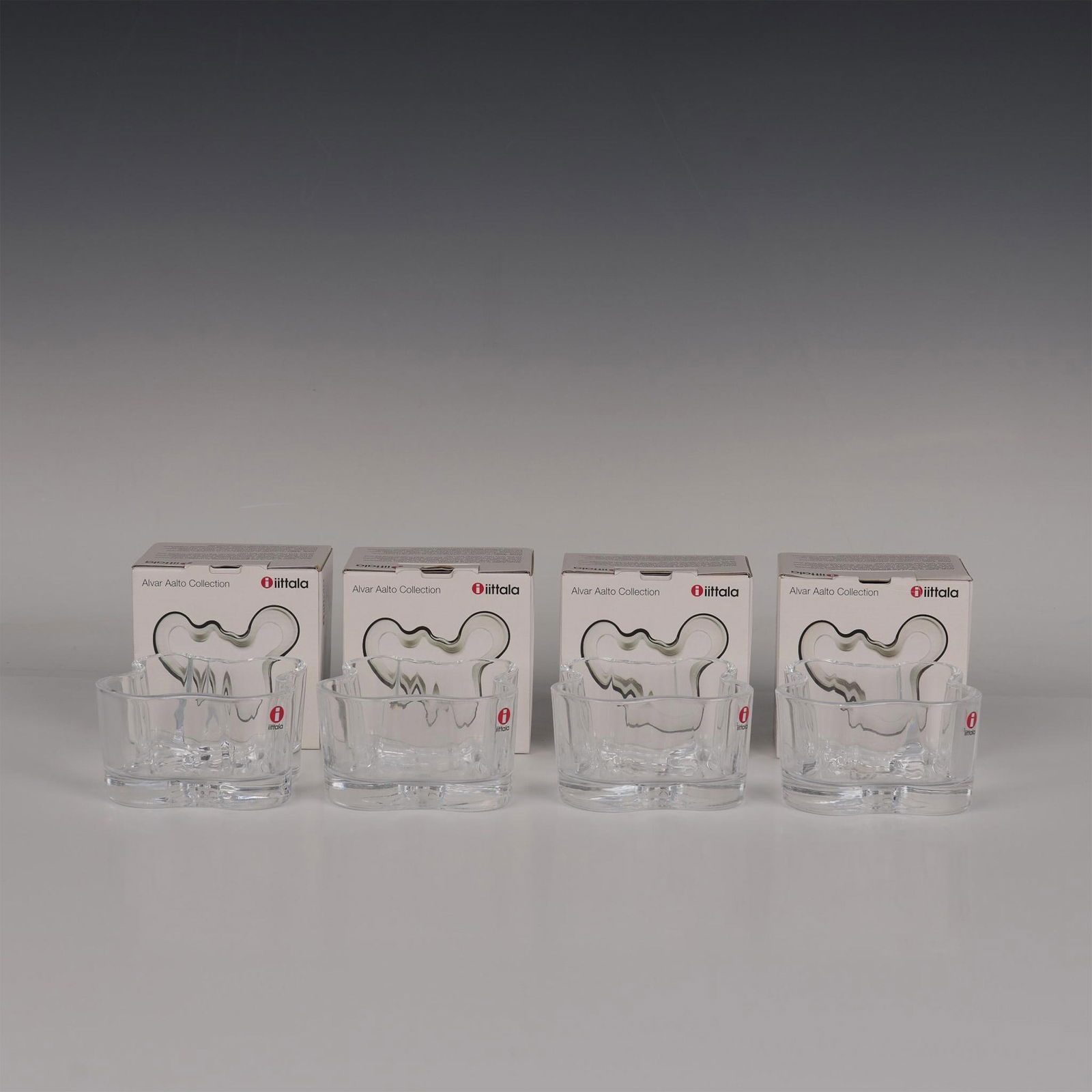 4pc Iittala Alvar Aalto Collection Votives: Legendary design pioneer Alvar Aalto took inspiration from his native Finnish landscape when creating his iconic waves shape. Aalto award-winning waves have become a symbol of Scandinavian design. All