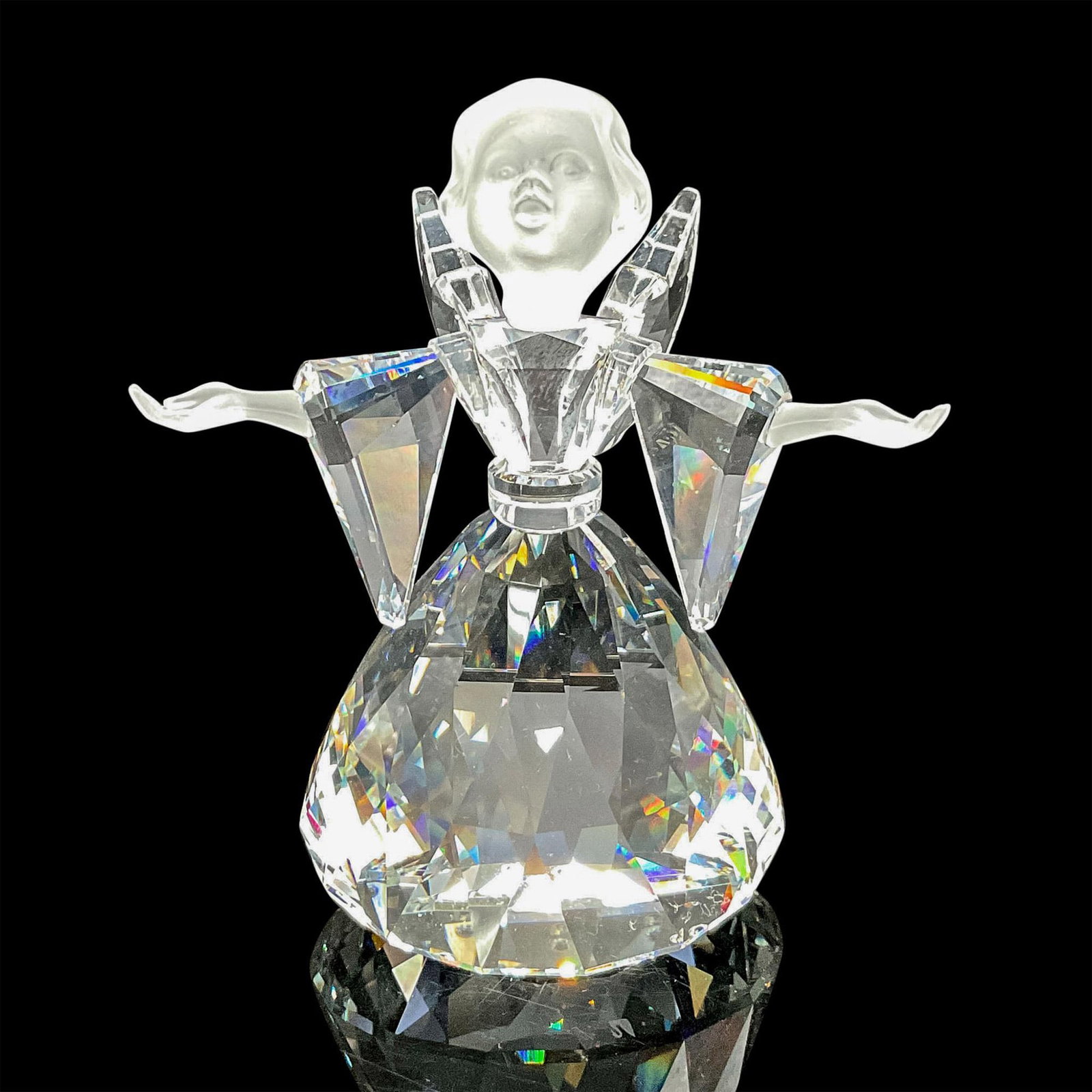 Swarovski Silver Crystal Figurine, Angel: Clear faceted crystal figural with satin crystal face and hands. Swarovski backstamp. 7475 000 060. This item has its original box: 5"H x 6"dia. Certificate of Authenticity included. Issued: 1995 - 20