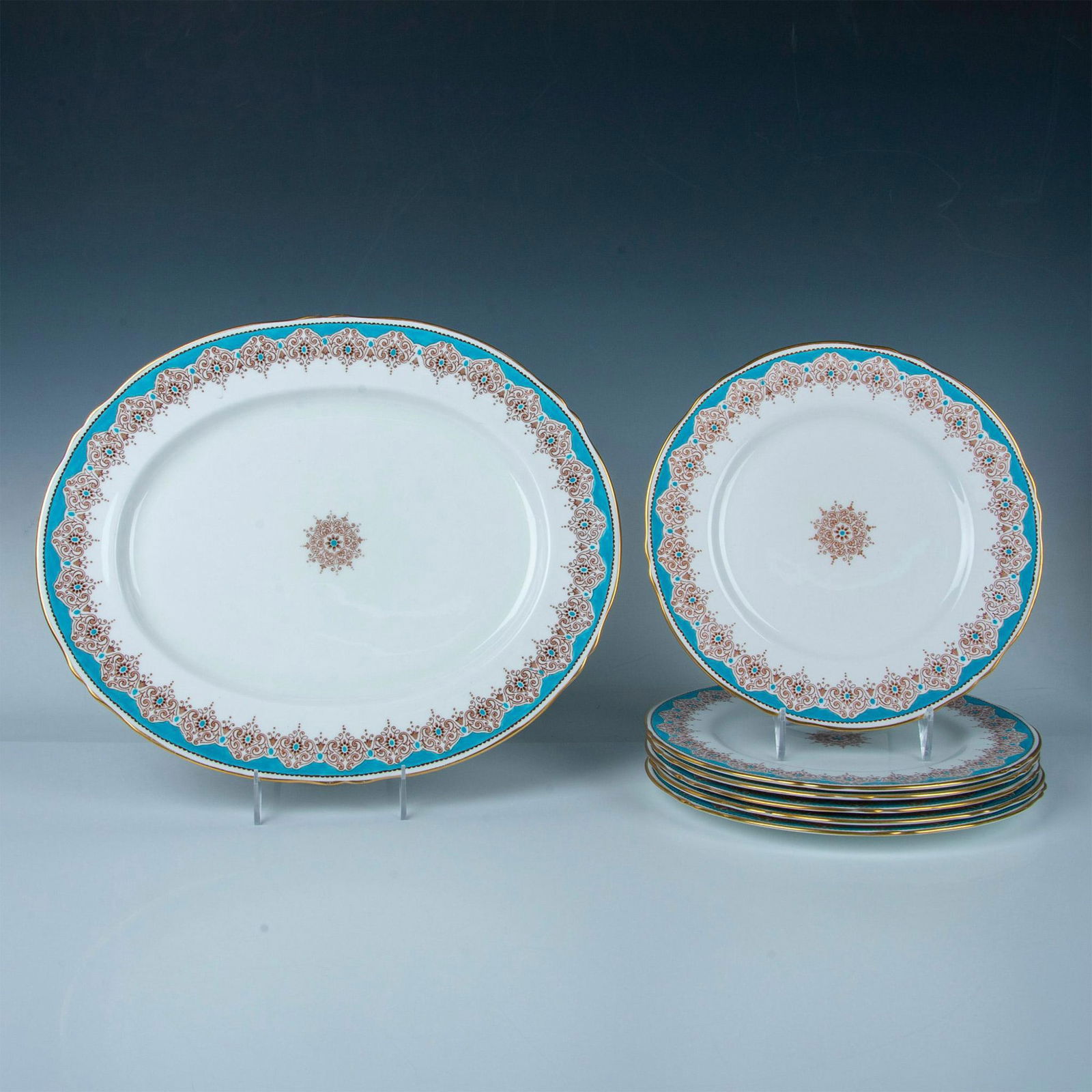 7pc Crown Staffordshire Plates and Platter, A16353: A set of six plates and one platter, featuring immaculate white with blue borders, gold trims, and intricate brown foliage art. Crown Staffordshire backstamp. Marked A16353. Dimensions of the largest