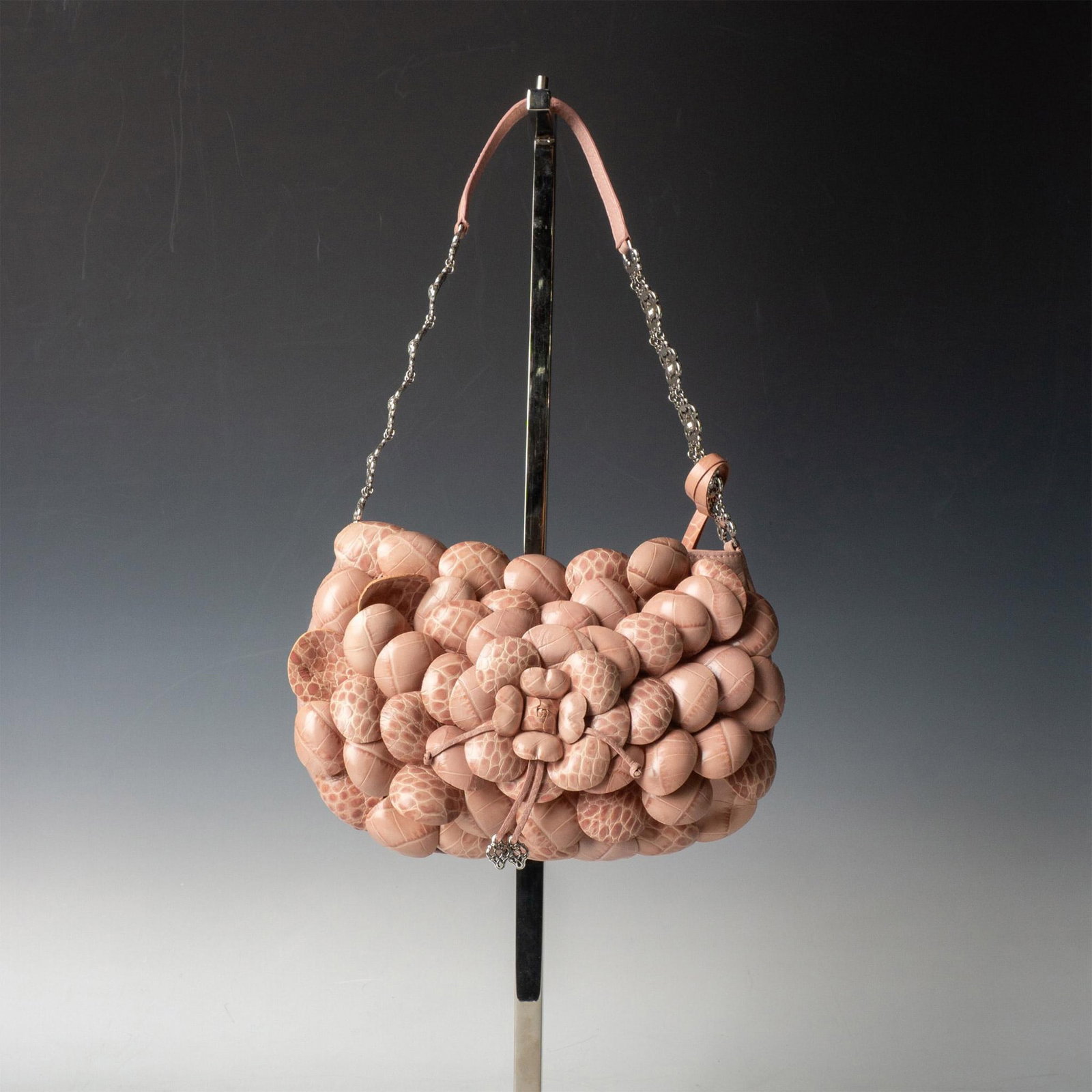 Brighton Leather Petal Shoulder Bag: Rose colored, zip top bag with metal and leather strap. Front of bag designed with leather petals. Back has convenience pocket. Interior is fabric lined with zip pocket. Brighton embossed number C5453