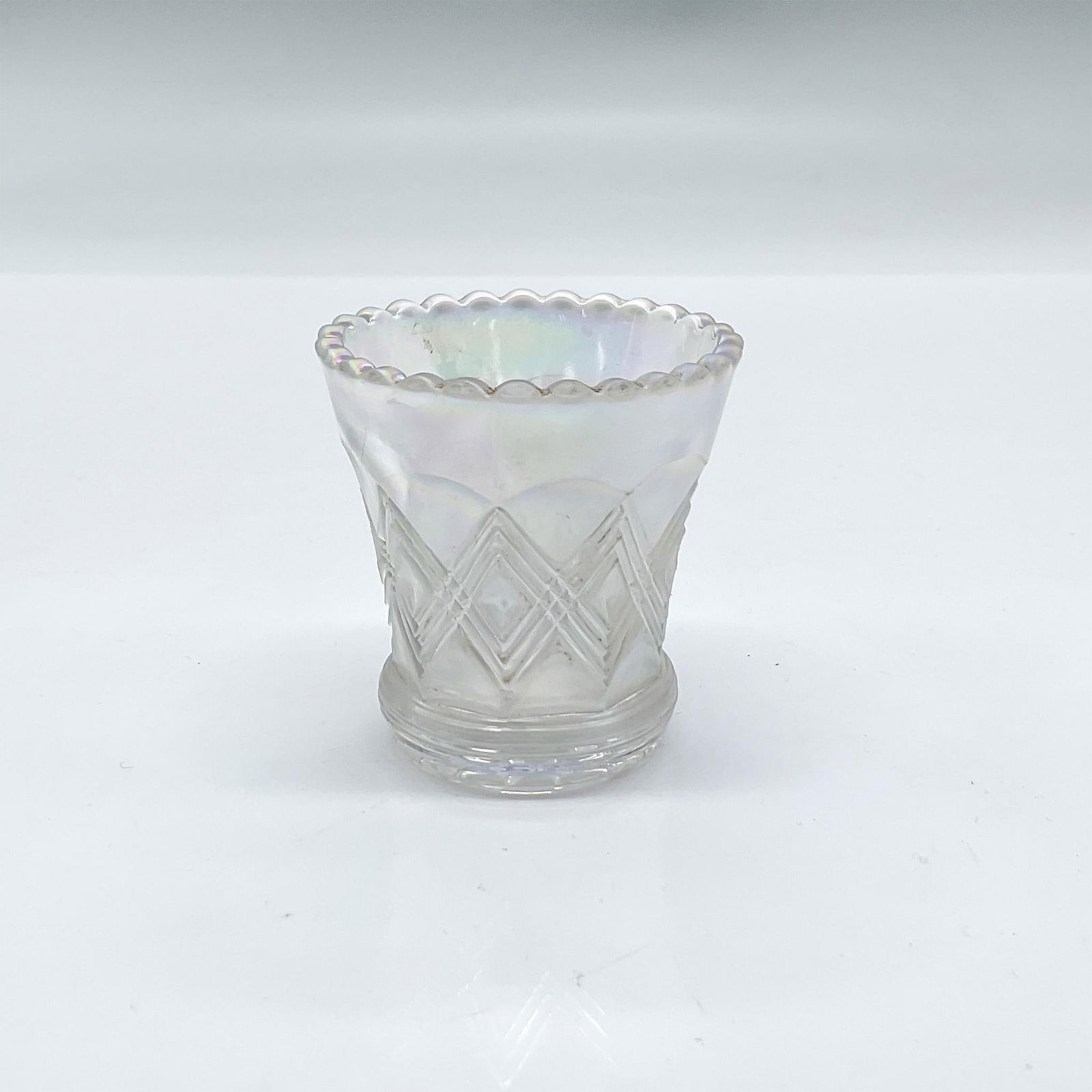 Vintage Iridescent Glass Toothpick Holder: Iridescent slightly opaque glass toothpick holder with a scalloped rim. Dimensions: 2.25"H x 2"dia