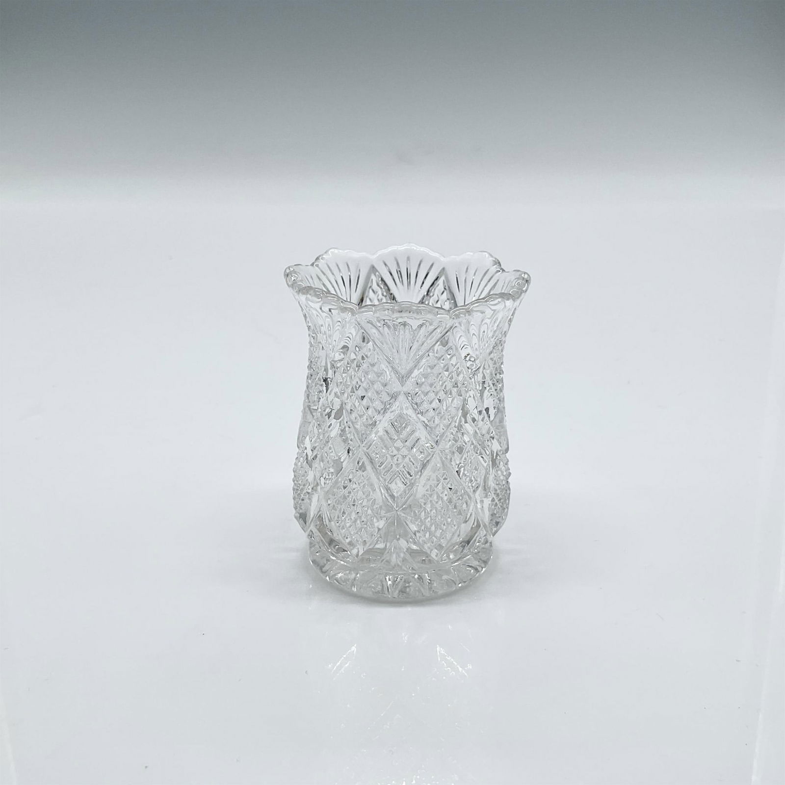 George Duncan Glass Toothpick Holder: Clear glass toothpick holder in a gorgeous paneled diamond block pattern. Dimensions: 2.5"H x 1.75"dia Manufacturer: George Duncan and Sons Glass Company