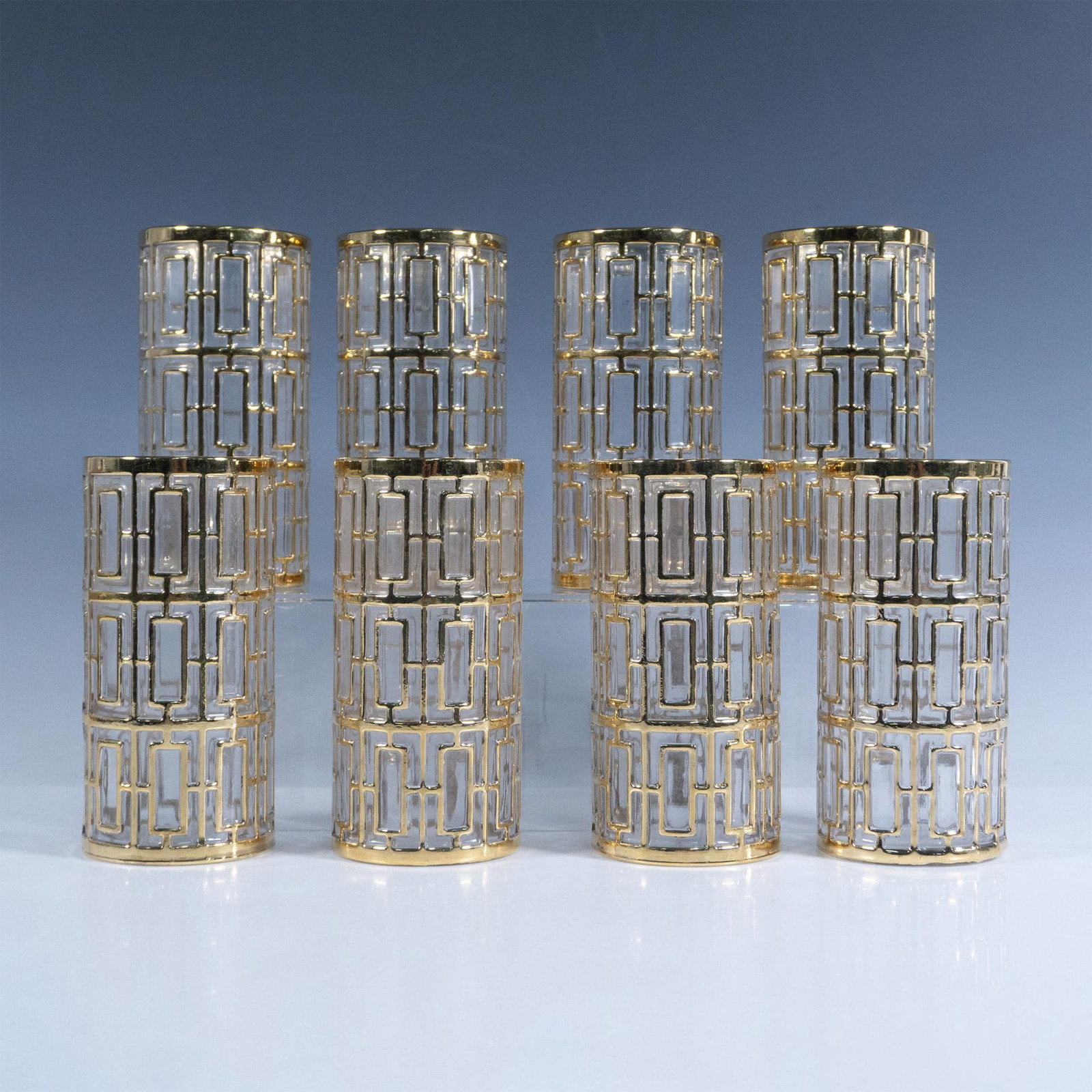 8pc Imperial Glass Shoji Style Highball Glasses: Eight glass tumblers with a gold-colored Art Deco pattern. Dimensions: 2.75"W x 5.75"H